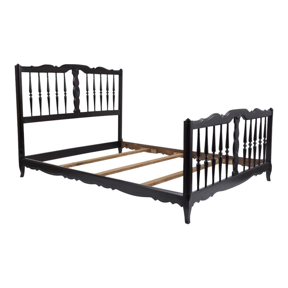 This French Provincial full-size bed frame has been completed restored, is made out of walnut wood, and features a new ebonized satin finish. The frame comes with head/footboard and wooden rails, each has beautiful hand carved floral details,