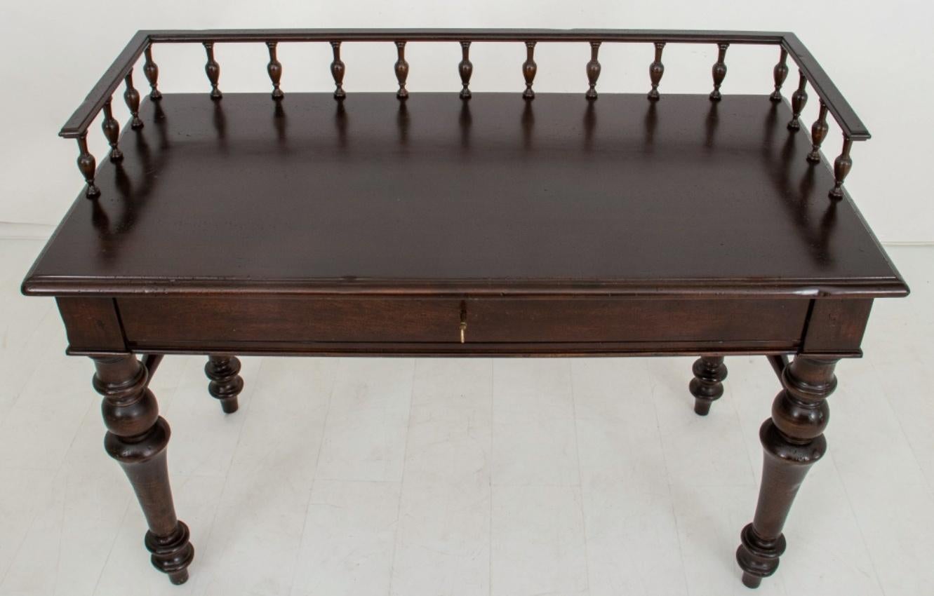 French Provincial ebonized galleried writing table or desk, with spindle gallery top on rectangular writing surface (30