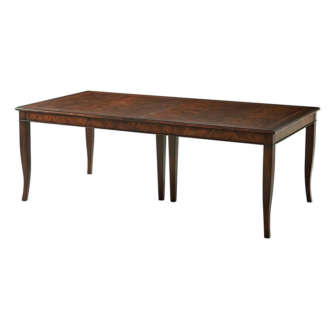 A Provincial veneered and mahogany extending dining table, the crossbanded rectangular top opening to accommodate one additional leaf, the veneered frieze above square tapering and splayed legs. Inspired by a 19th-century French
