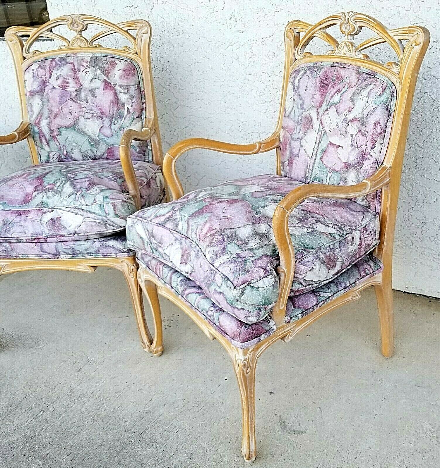 Offering one of our recent Palm Beach home furnishings acquisition of a 
Pair of French Provincial Fauteuil carved wood upholstered accent chairs armchairs
With very comfortable foam and down cushions for maximum comfort without