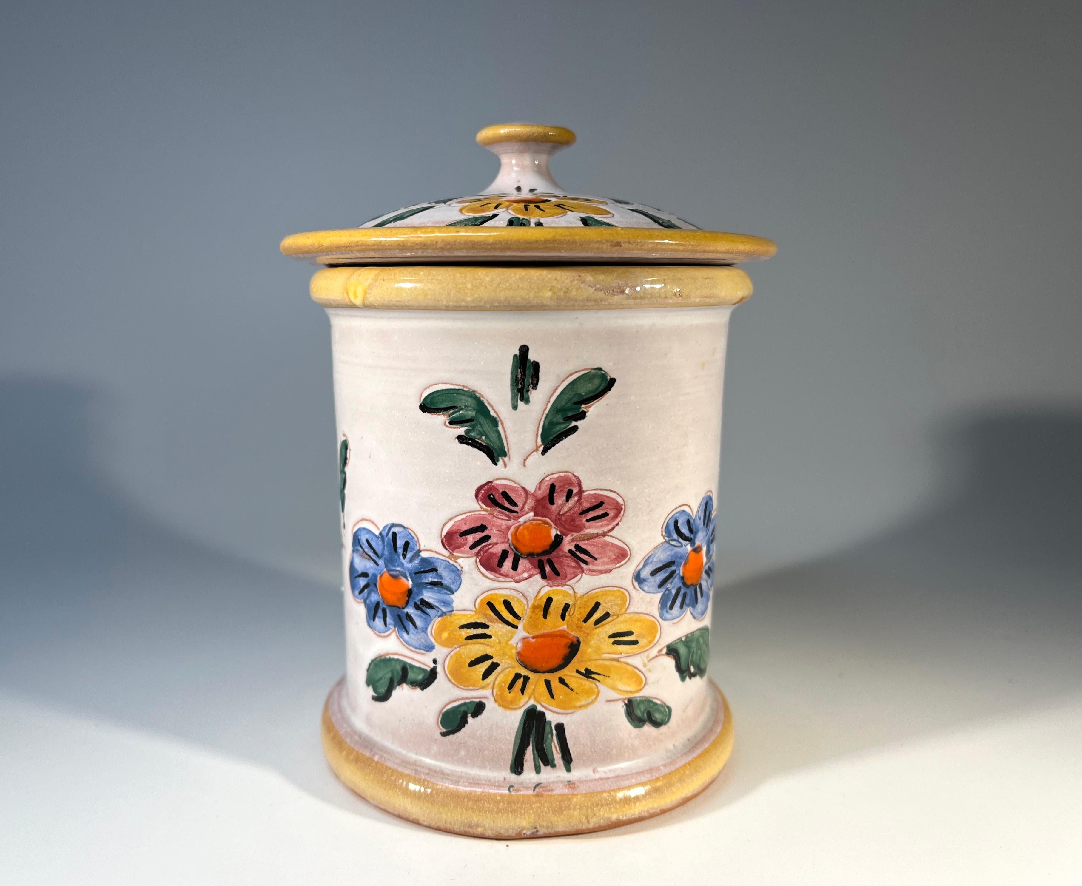 Delightful French provincial ceramic tobacco jar from Vallauris, France.
Cheerfully hand painted with country-style  flowers and etched Tabac on lid
Stamped Aegitna Vallauris on base
Circa Mid-20th Century
Height 4.5 inch, Diameter 3.5 inch
In good