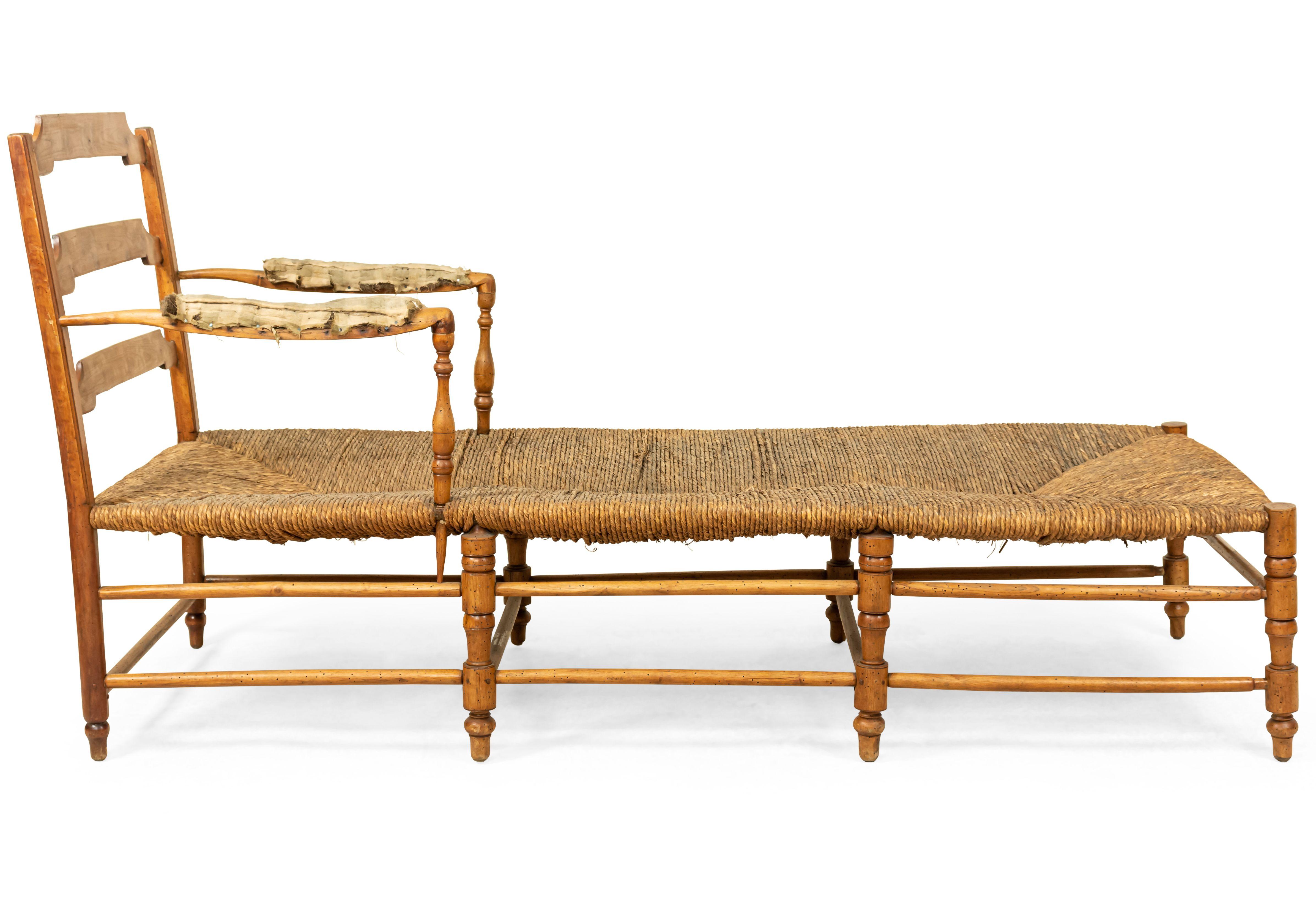 French Provincial (19th century) fruitwood ladder back chaise with rush seat.