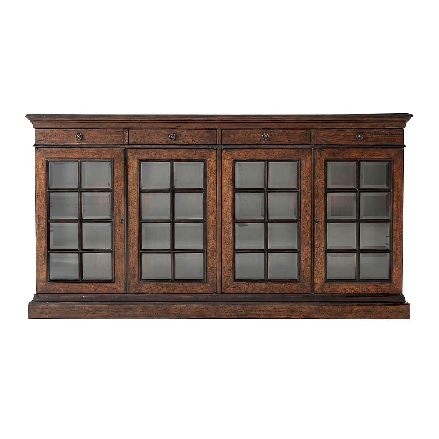 French provincial buffet cabinet with a molded edge rectangular parquetry top and four frieze drawers, above cabinet doors with beveled glass panels. The interior two sections with fixed shelves and raised on a plinth base.
Dimensions: 67.25