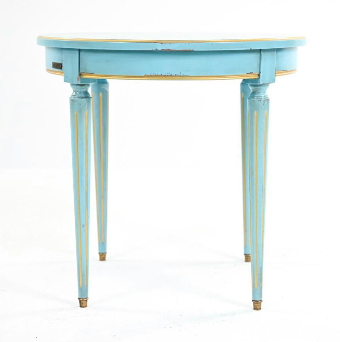 French Provincial Grange Petite French blue gold-leafed side table, Fluted Legs. 

Petite French blue and gold leafed side table with fluted legs. With Grange plaque on apron and 2005 label underneath. Dimensions: H 21
