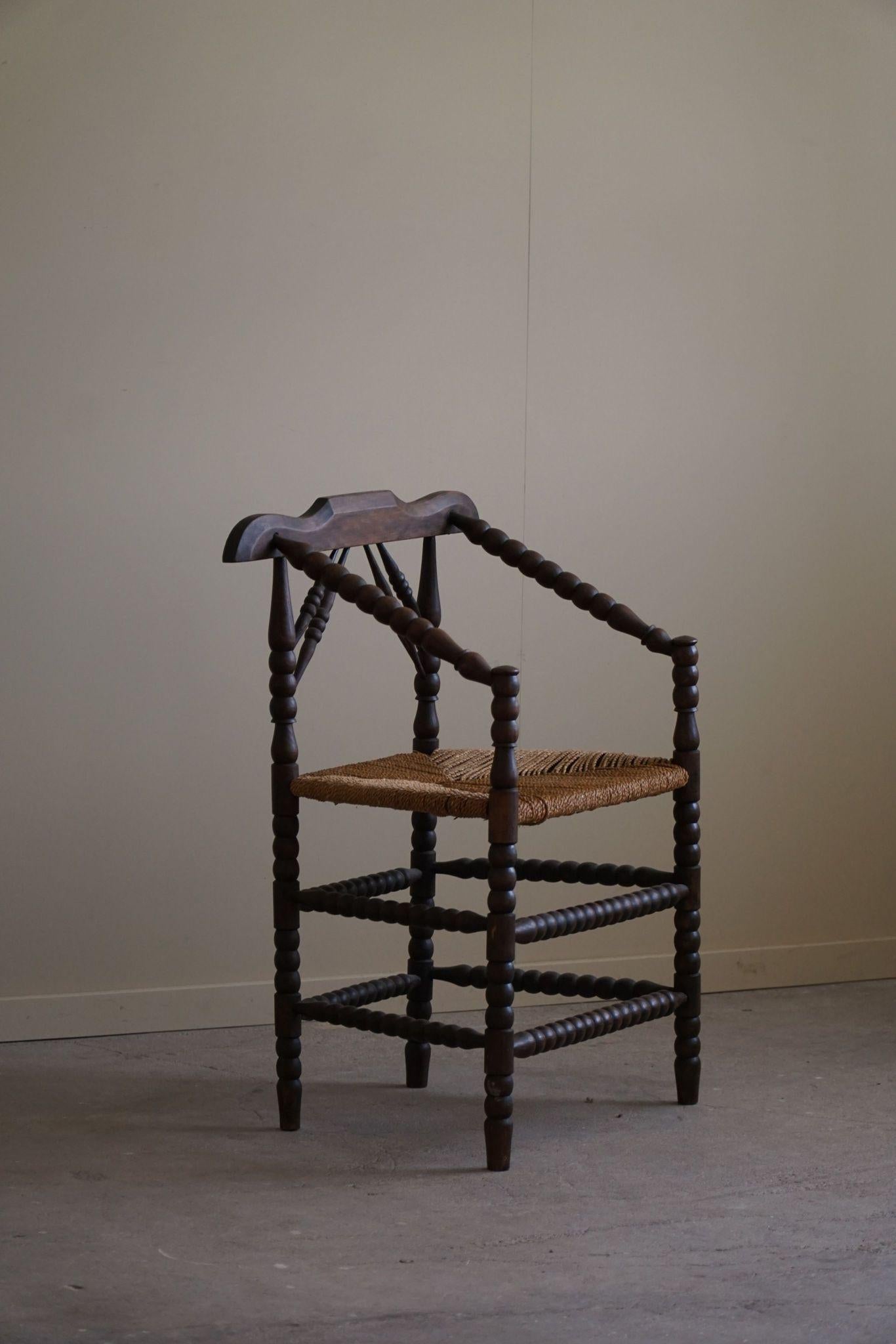 A beautiful French Provincial armchair / desk chair in stained oak with a fine rustic seagrass seat. Classic bobbin turned body and in an overall fine vintage condition. Made in the 20th century.

This lovely hand crafted chair will complement many