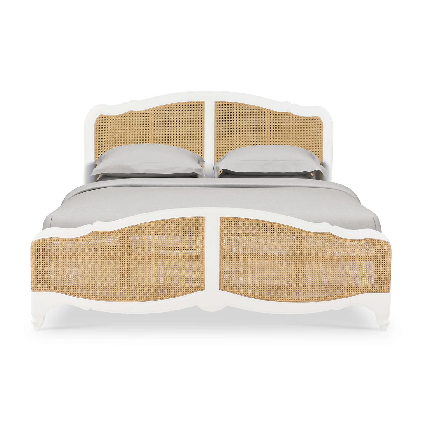 An 18th-century inspired, Louis XV-style carved bedframe, in a light hand-rubbed and distressed Architectural White finish.

The serpentine crest headboard features inset caned rattan in a natural finish. The serpentine footboard with inset rattan