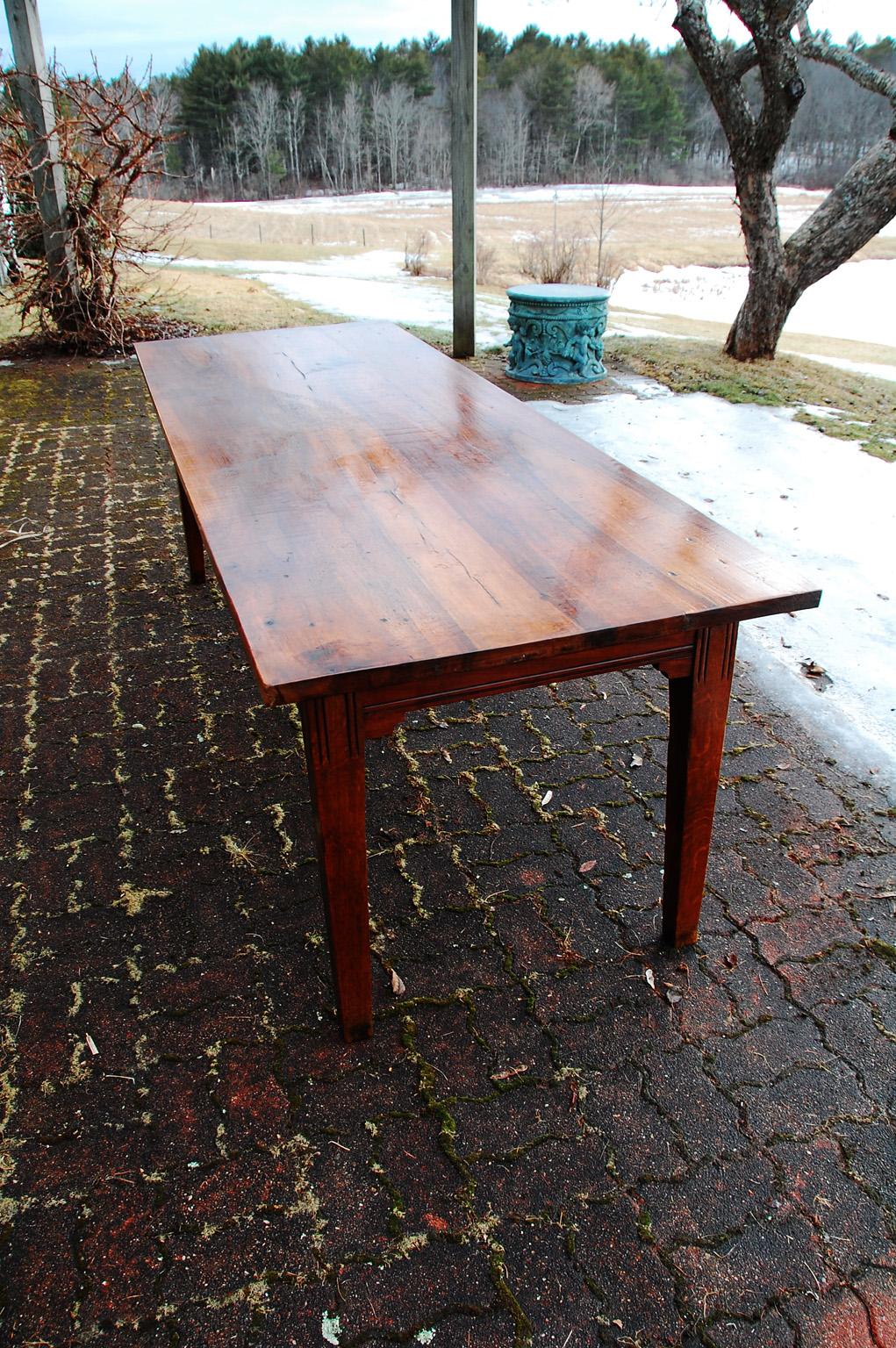 French provincial farmhouse table from the Burgundy region of France. The table top is thicker than normal, almost an inch and a half, of planked walnut with wonderful graining. The base is of oak has two drawers, one on each long side and tapered