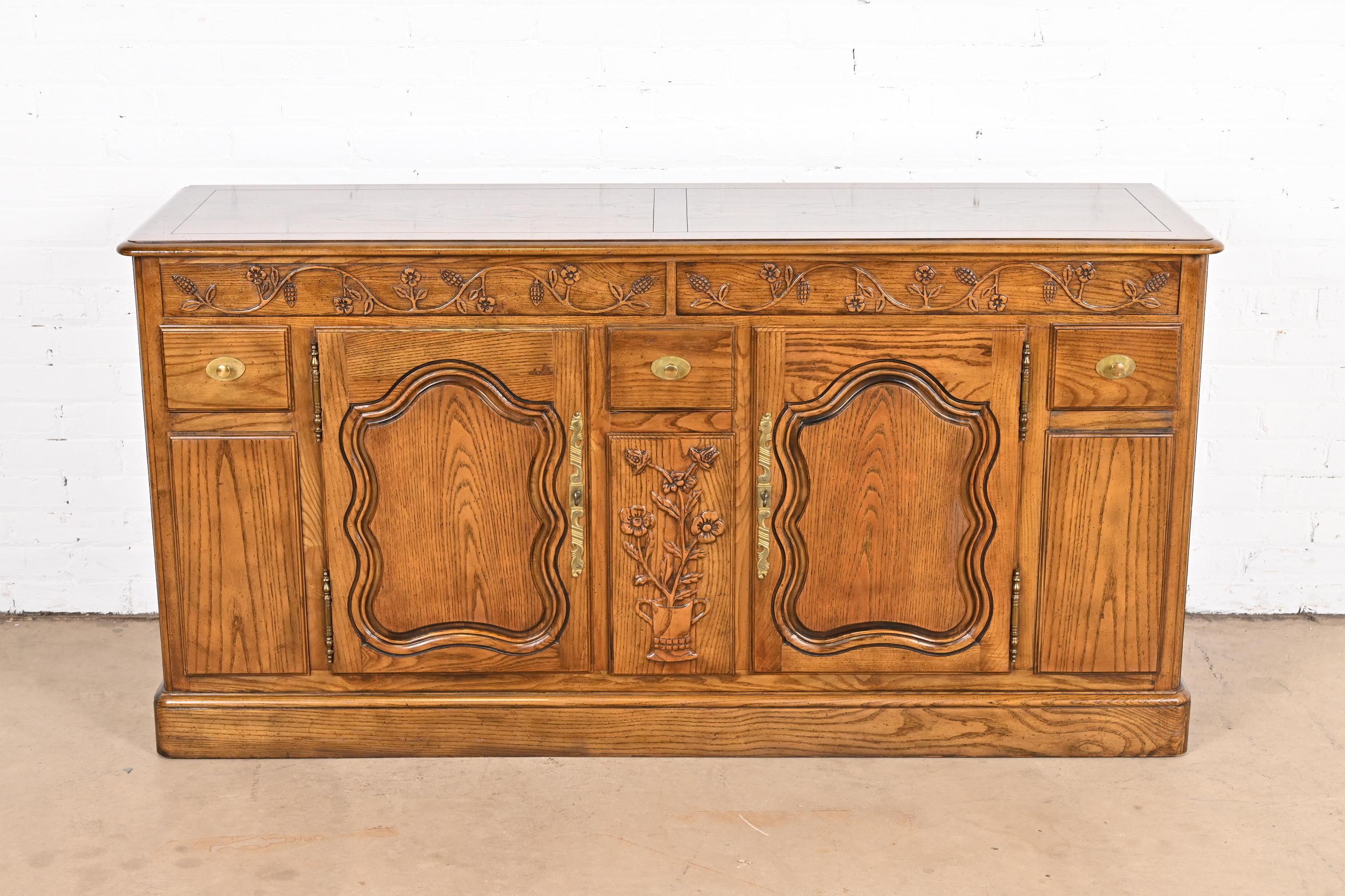 French Provincial Louis XV Carved Oak Sideboard in the Manner of Baker