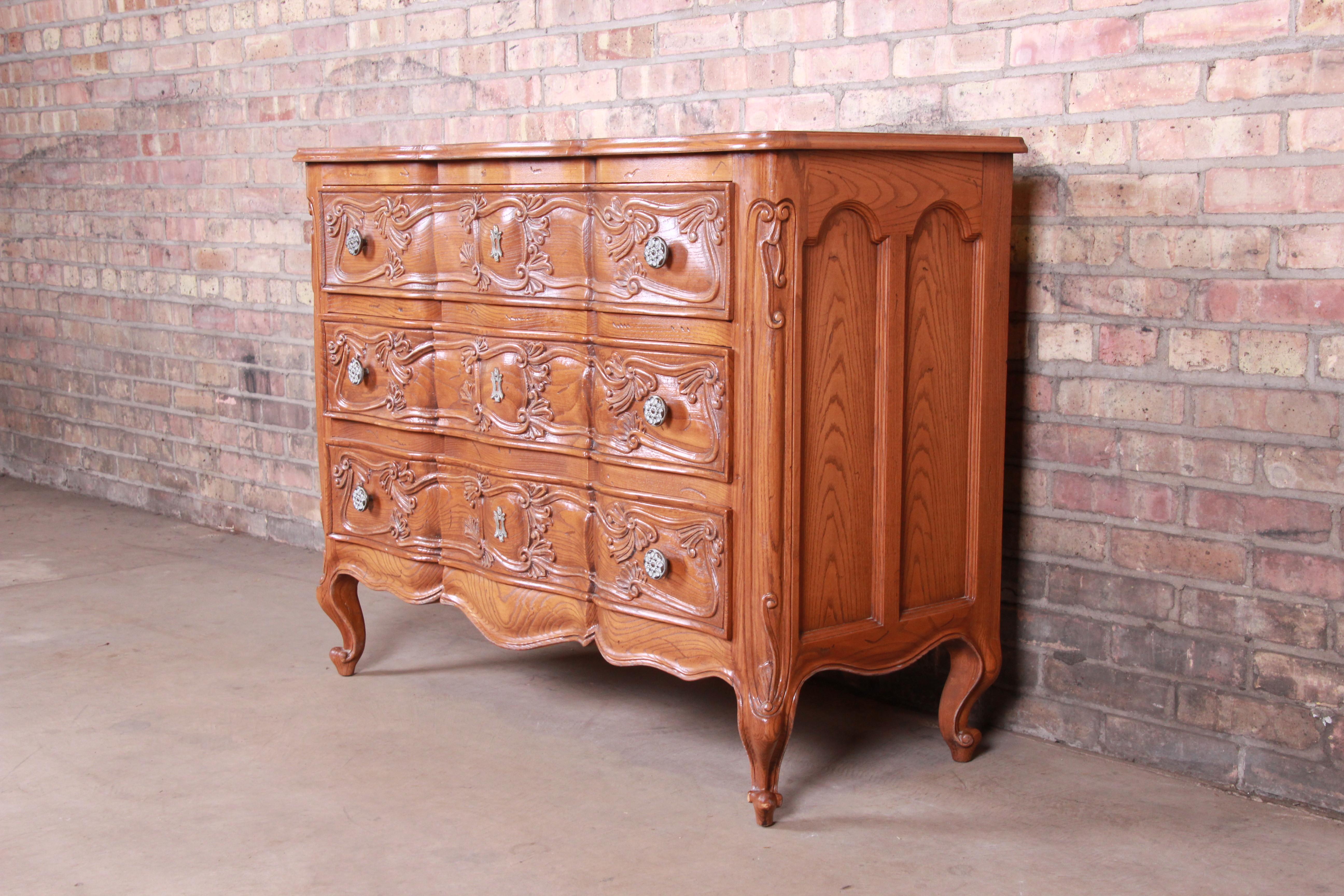 A gorgeous French Provincial Louis XV style carved oak dresser chest

By Henredon Furniture 