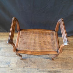 French Provincial Louis XV Carved Walnut Bench or Ottoman with Caning