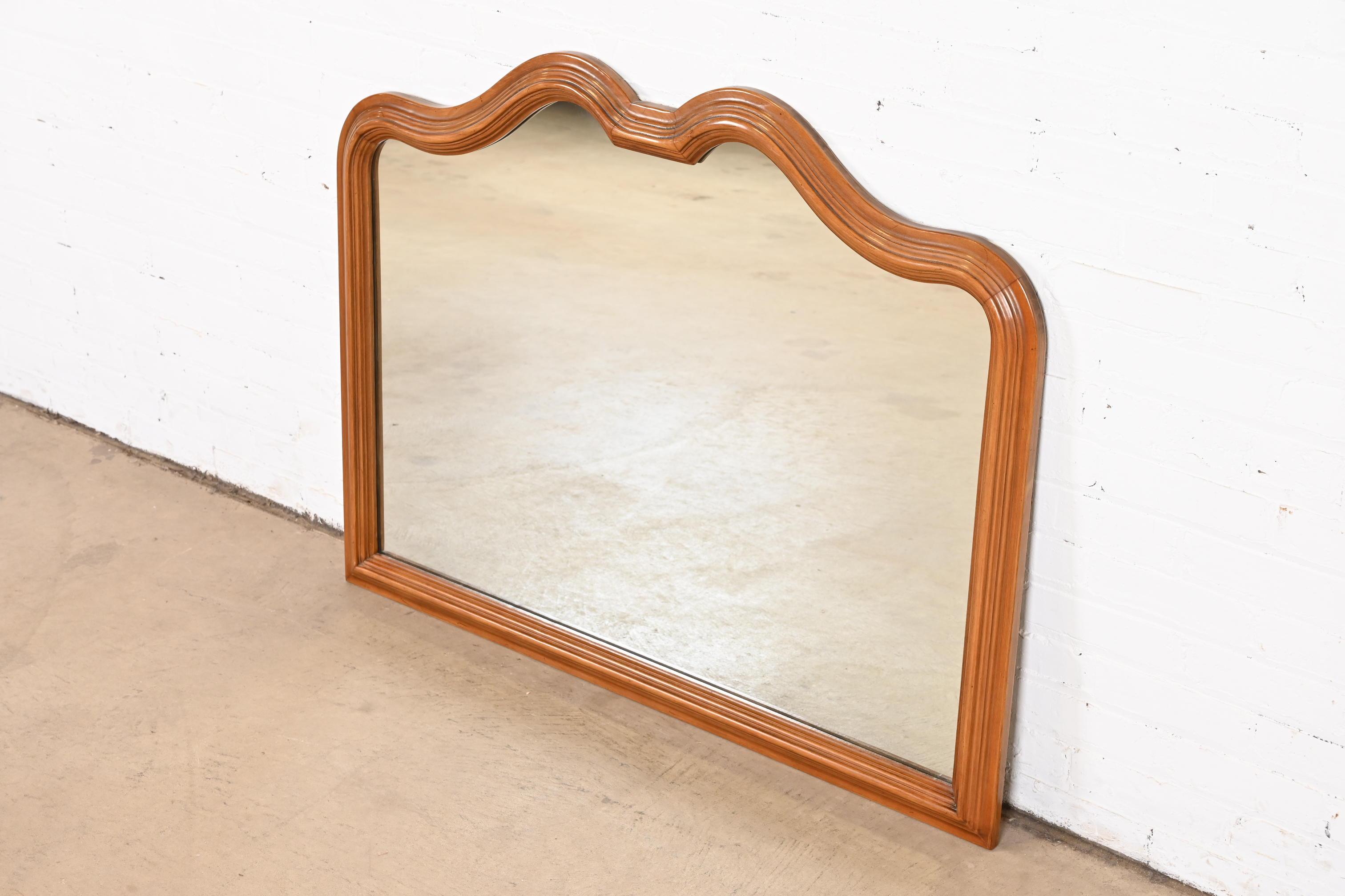 French Provincial Louis XV Carved Walnut Wall Mirror by Davis Cabinet Co. In Good Condition In South Bend, IN