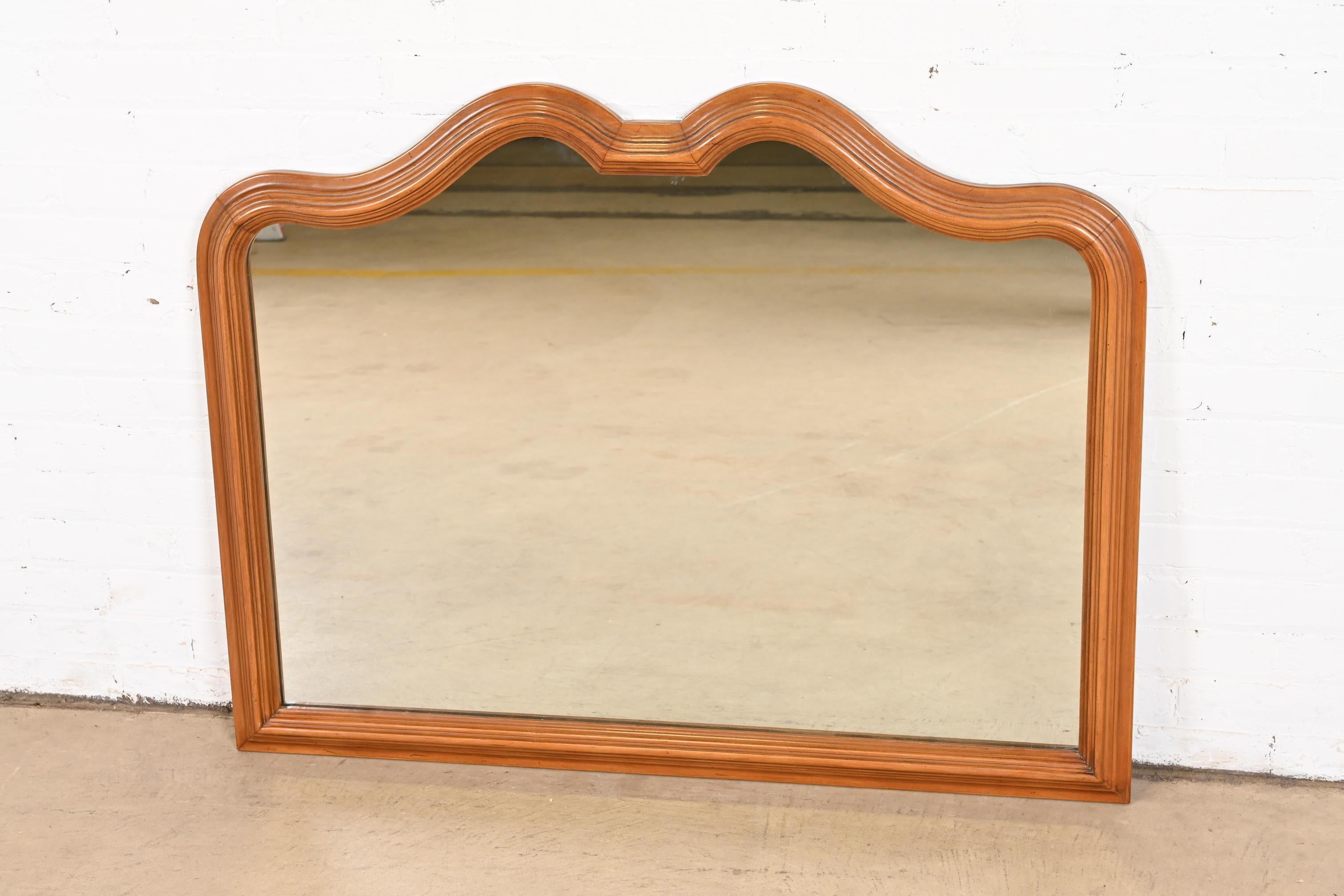 Mid-20th Century French Provincial Louis XV Carved Walnut Wall Mirror by Davis Cabinet Co.