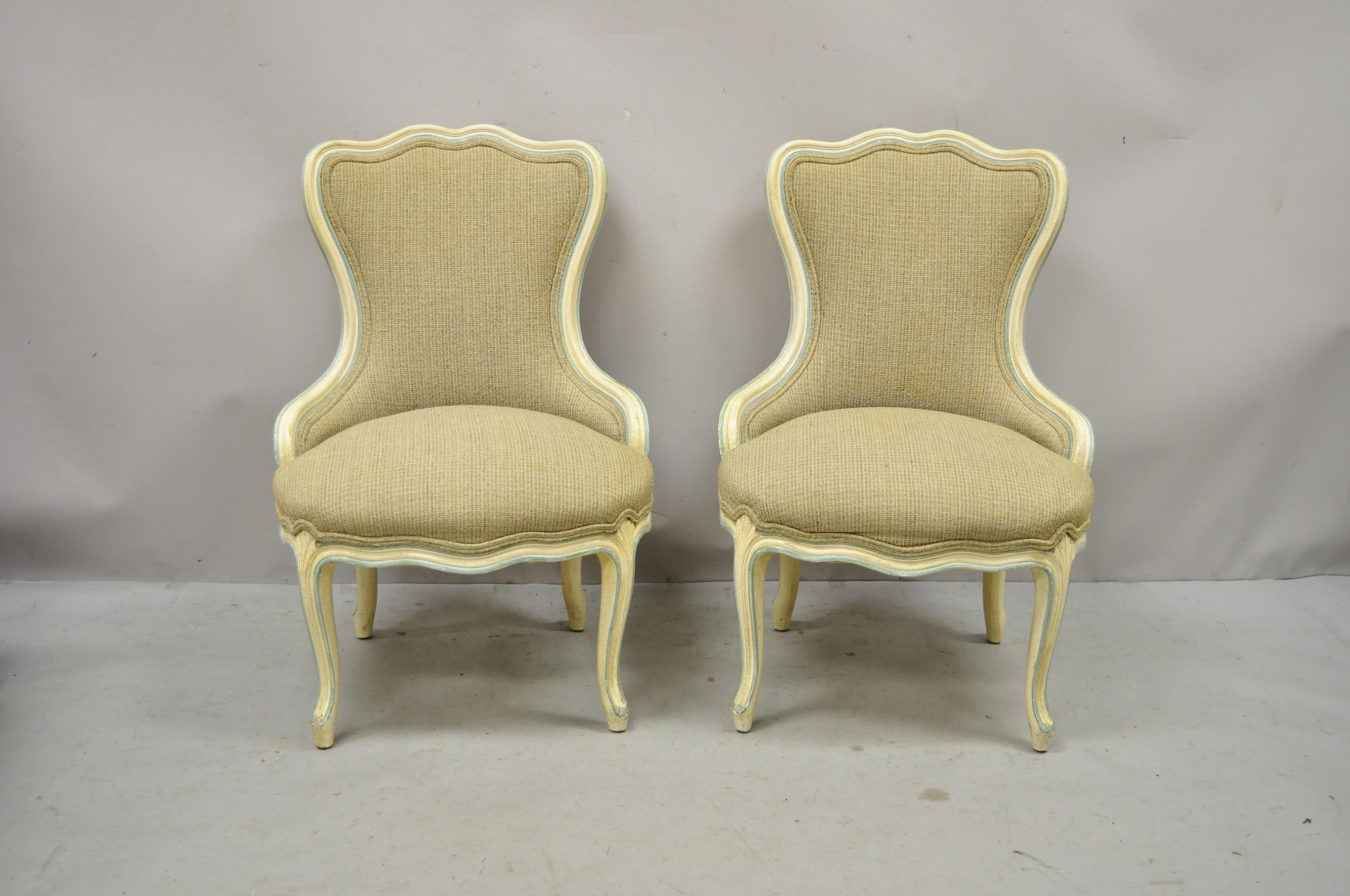 Vintage French Provincial Louis XV style cream and blue hiprest boudoir slipper Chairs - a Pair. Item features nice petite size, cream and blue distress painted frames, shapely carved backs, carved hiprest, cabriole legs, very nice vintage pair,