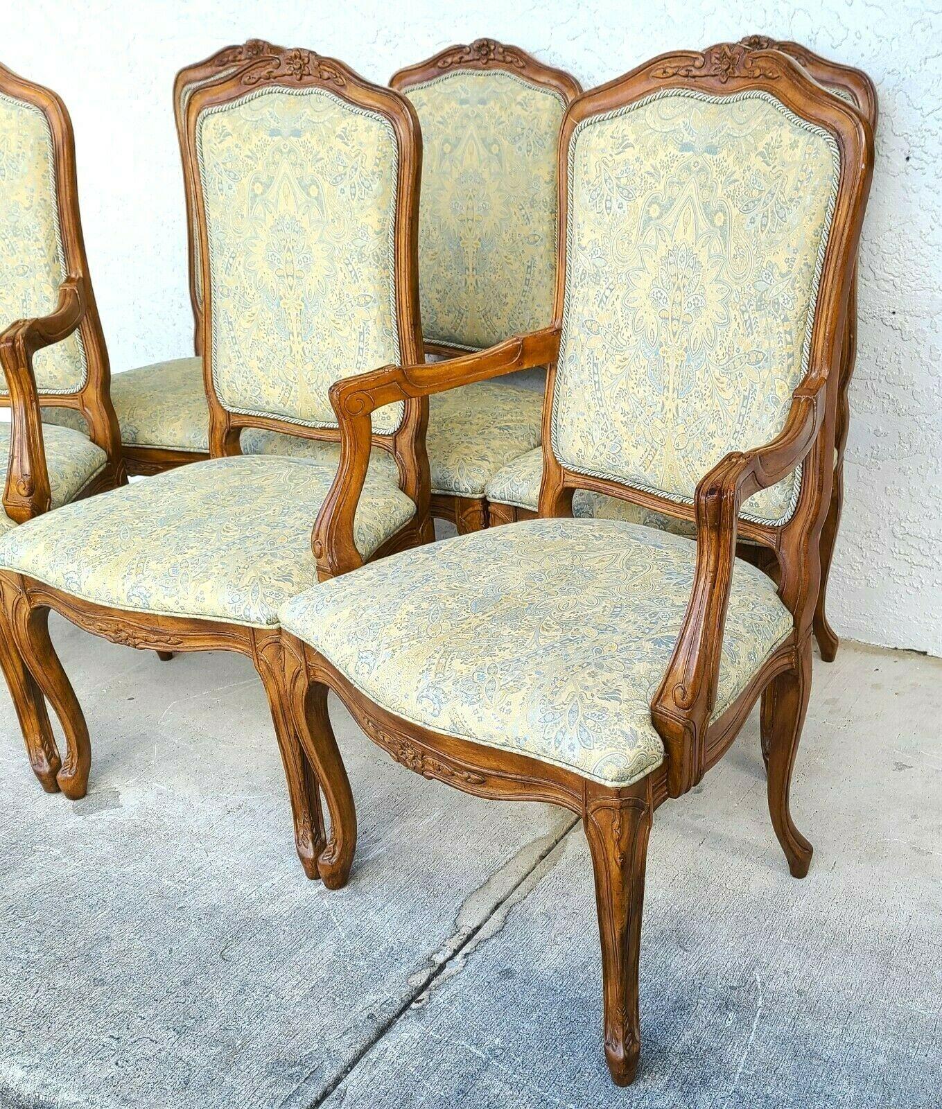 Offering one of our recent palm beach estate fine furniture acquisitions of A 
Set of 6 French Provincial Louis XV dining chairs 
With floral carvings in solid wood.
Set includes 4 side and 2 armchairs.

Approximate Measurements in Inches
Side