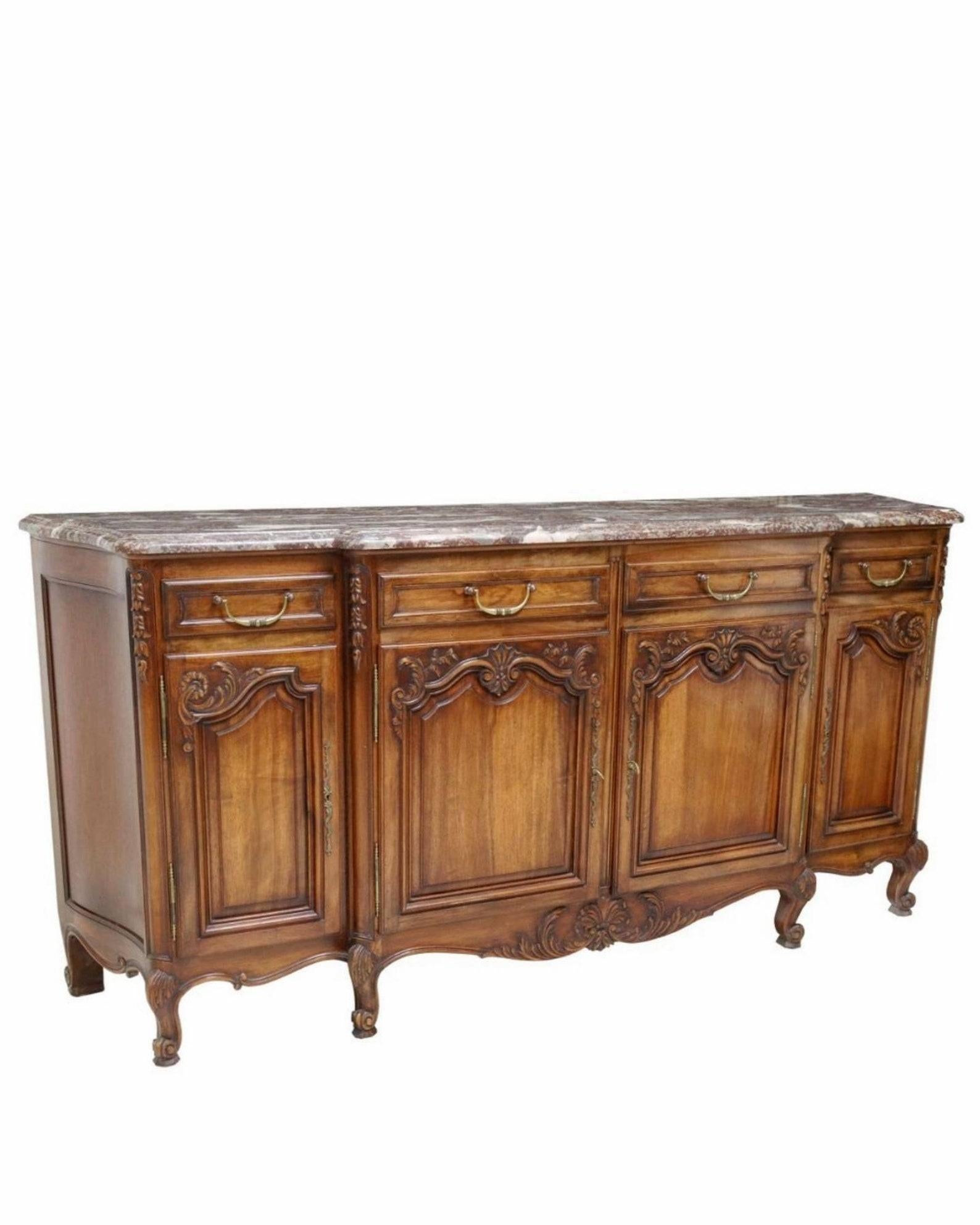 A vintage French Provincial Louis XV style carved walnut sideboard.

Hand-crafted in France in the mid-20th century, excellent quality, exceptionally executed in timeless 18th century Louis XV Regence taste, having a shaped marble top with