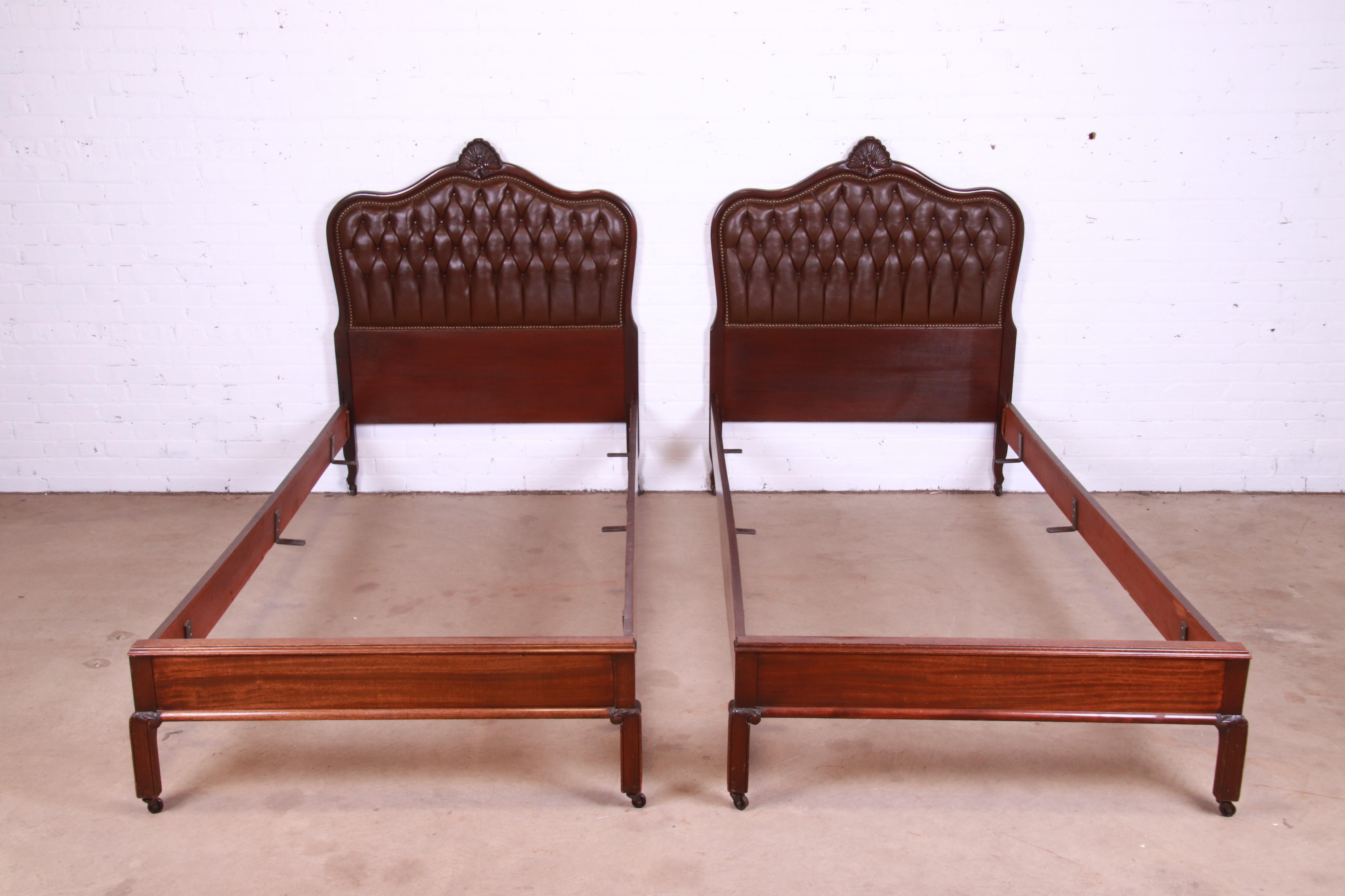 A gorgeous pair of French Provincial Louis XV style twin beds

By Robert Lewis Fine Furniture

USA, Circa 1950s

Carved mahogany, with brass studded tufted leather.

Measures: 41.75