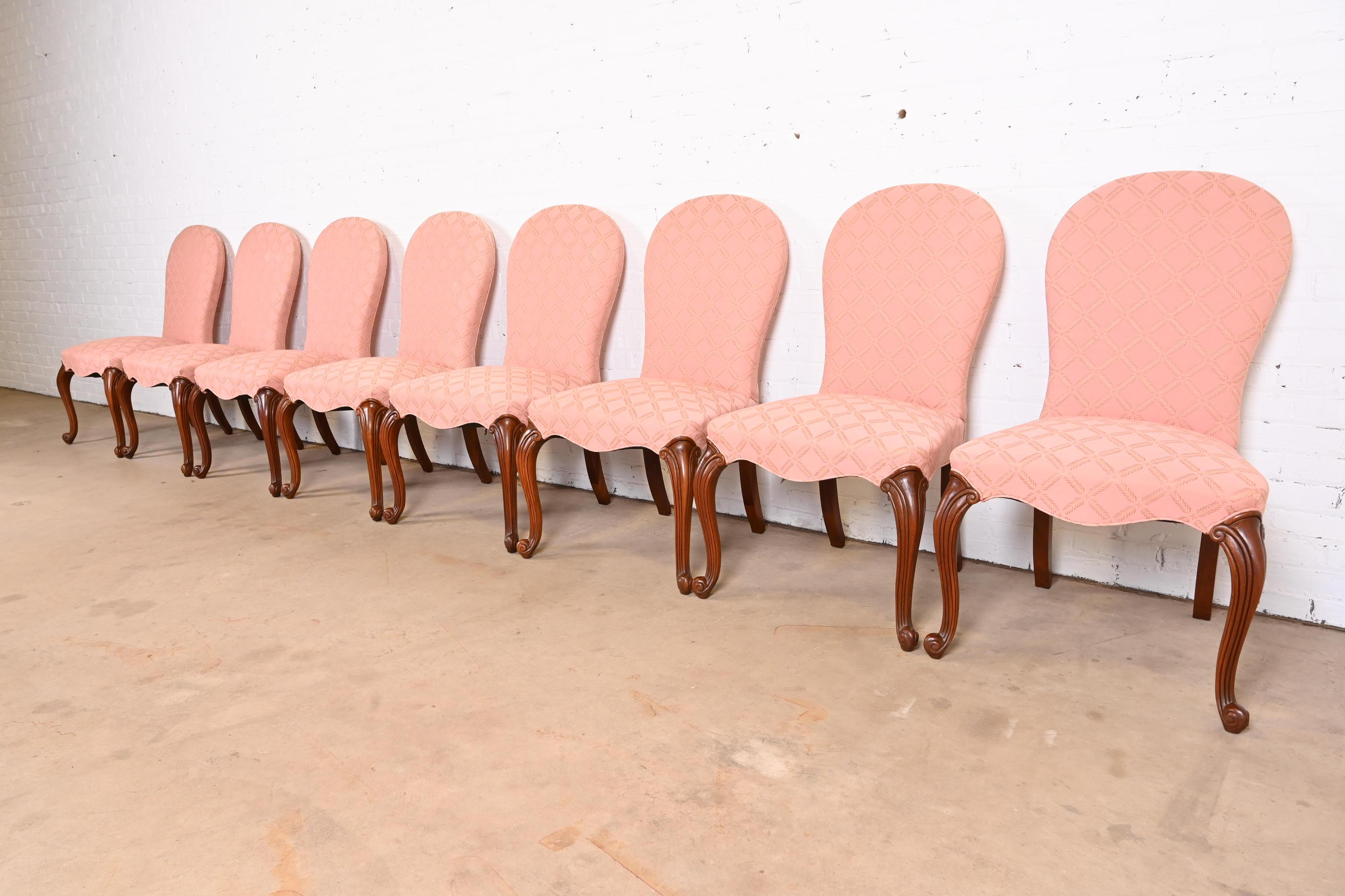 A gorgeous set of eight French Provincial Louis XV style dining chairs.

By Hickory Chair Co.

USA, Late 20th Century

Upholstered seats and backs, with carved walnut legs.

Measures: 23.5