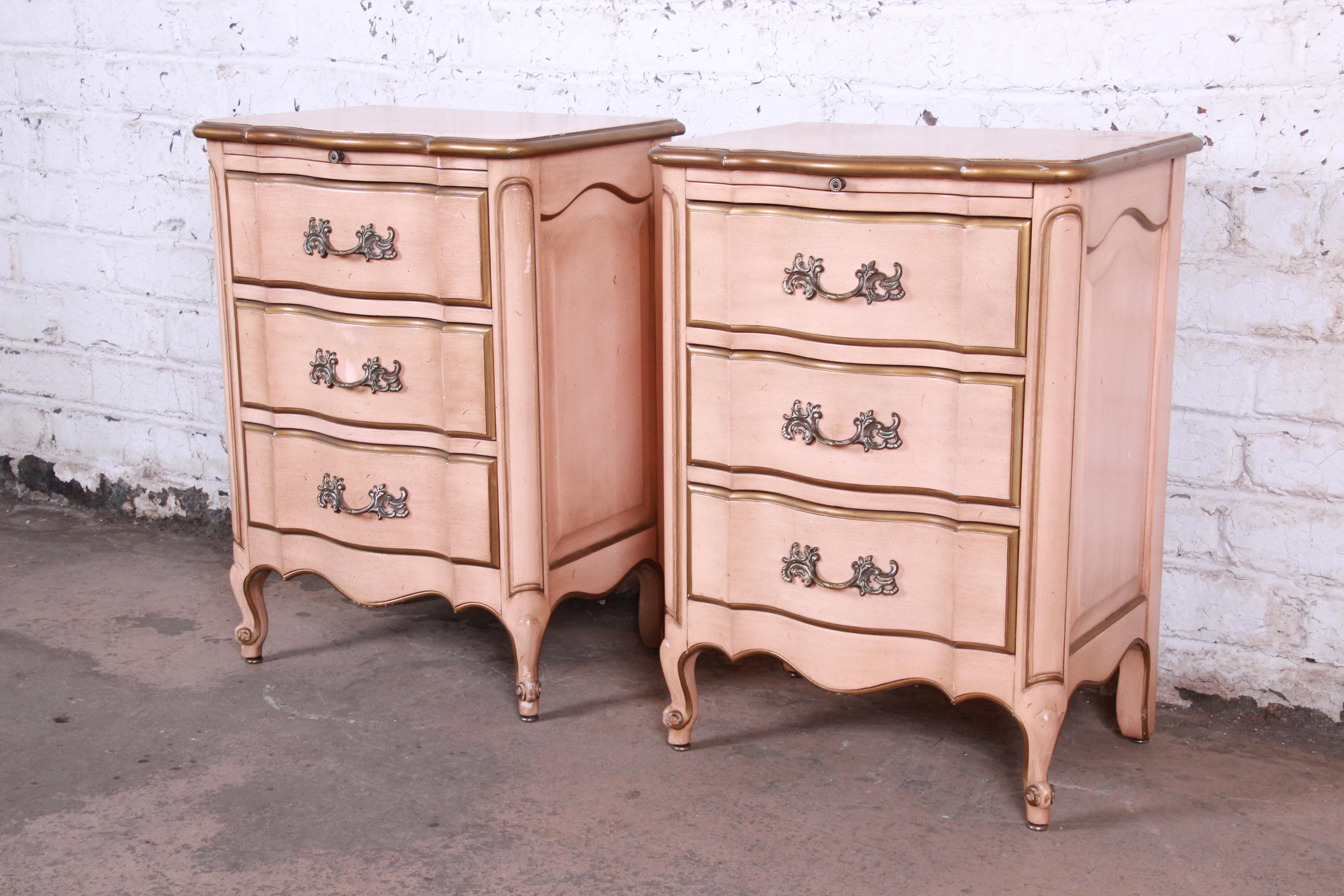 A beautiful pair of midcentury French Provincial Louis XV style nightstands

From 