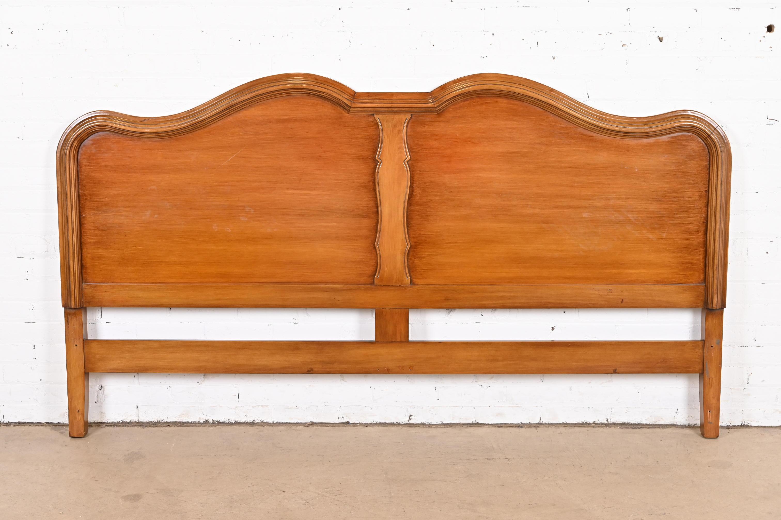A gorgeous French Provincial Louis XV style carved walnut king size headboard

By Davis Cabinet Co.

USA, Circa 1950s

Measures: 79.25