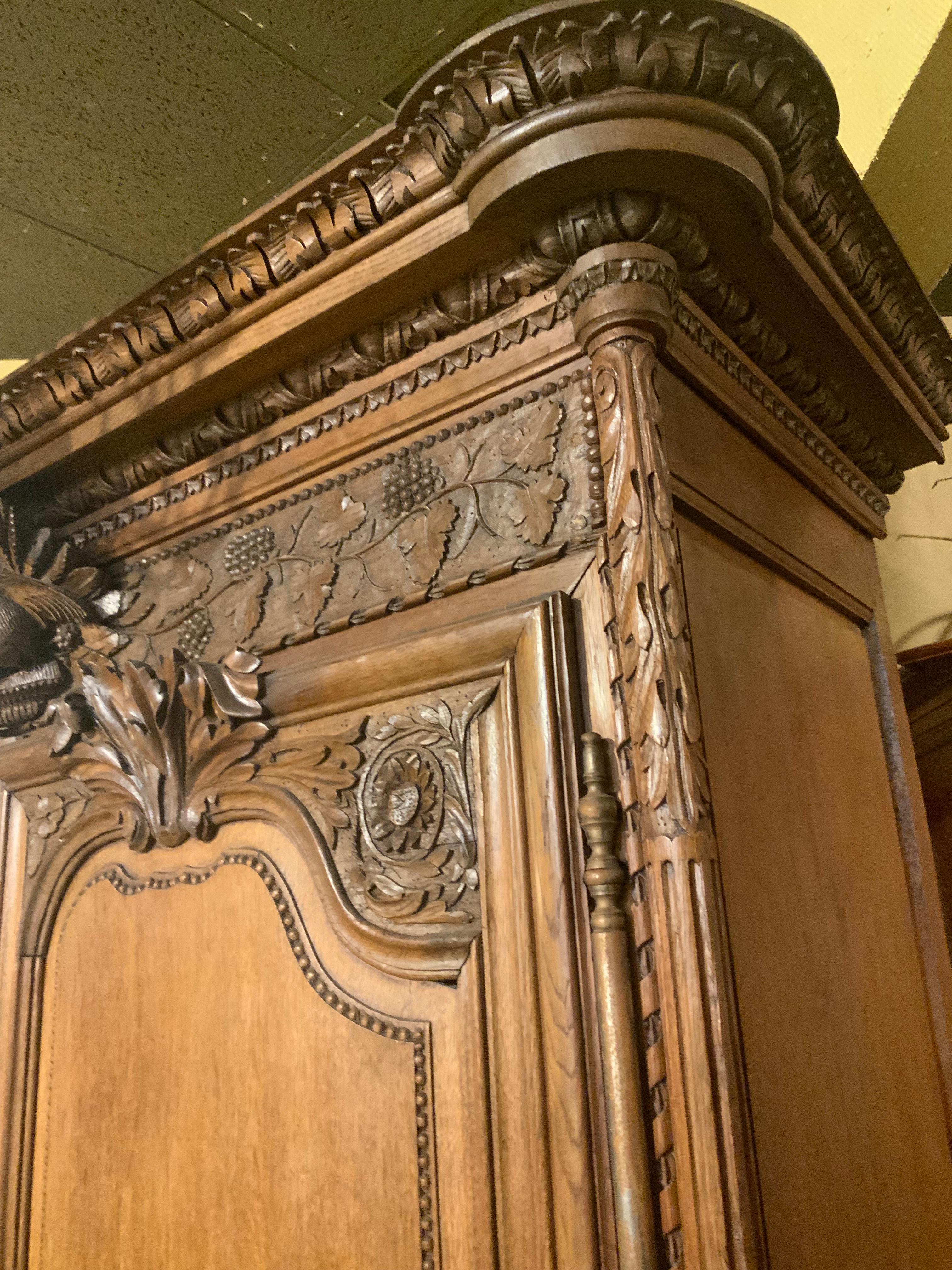 French provincial oak wedding armoire. 19 th c. With carved love birds 3