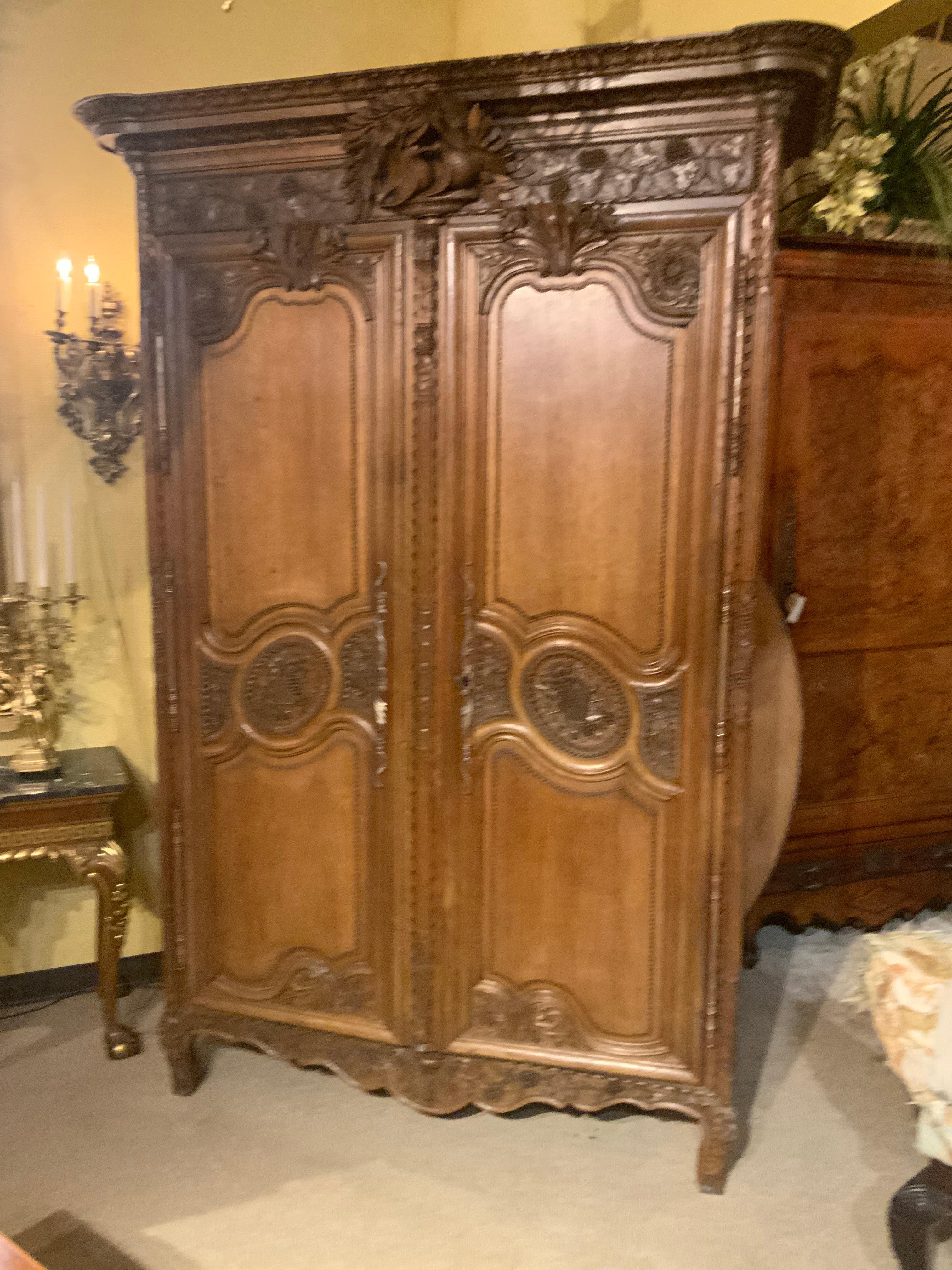 Hand-Carved French provincial oak wedding armoire. 19 th c. With carved love birds