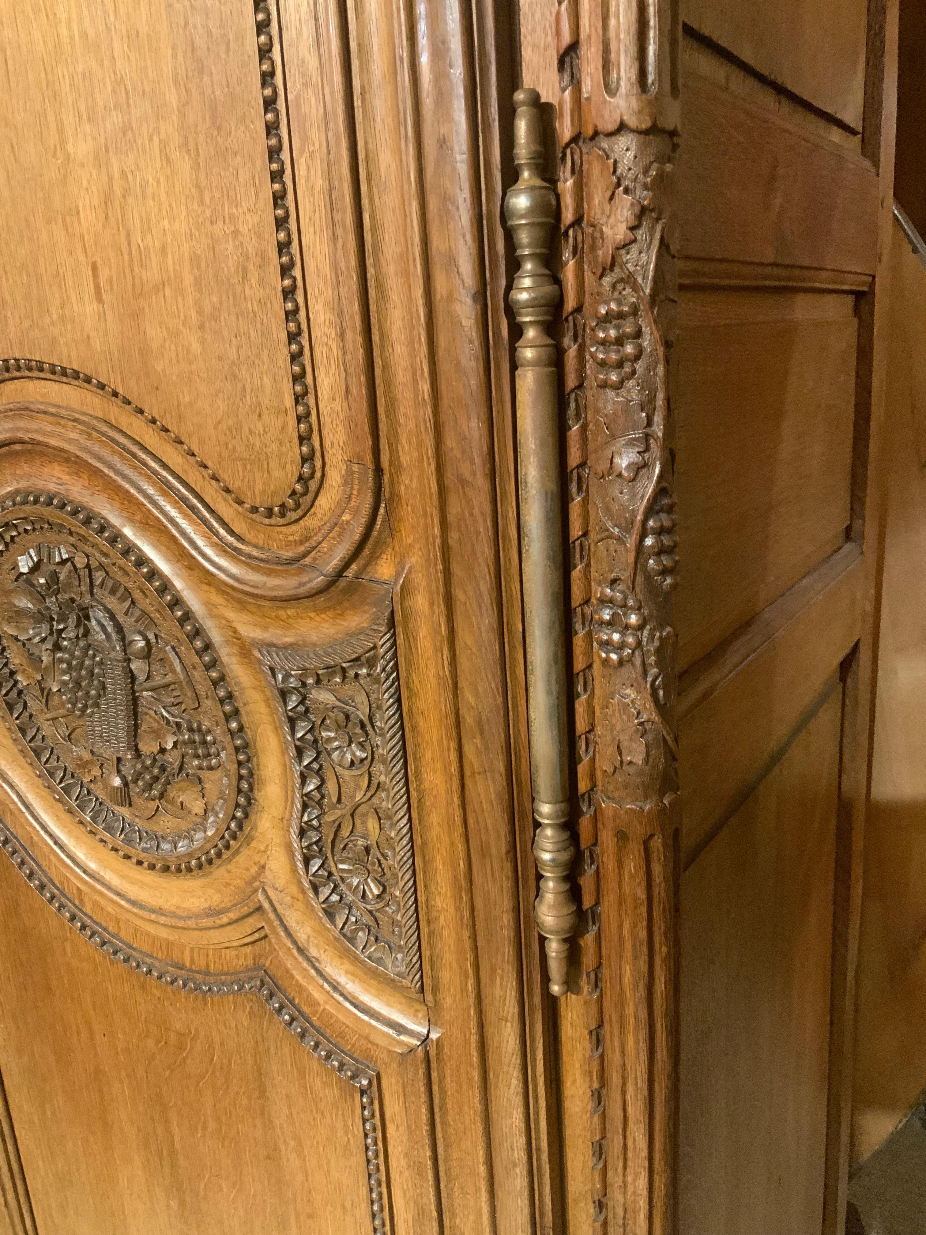 French provincial oak wedding armoire. 19 th c. With carved love birds 1