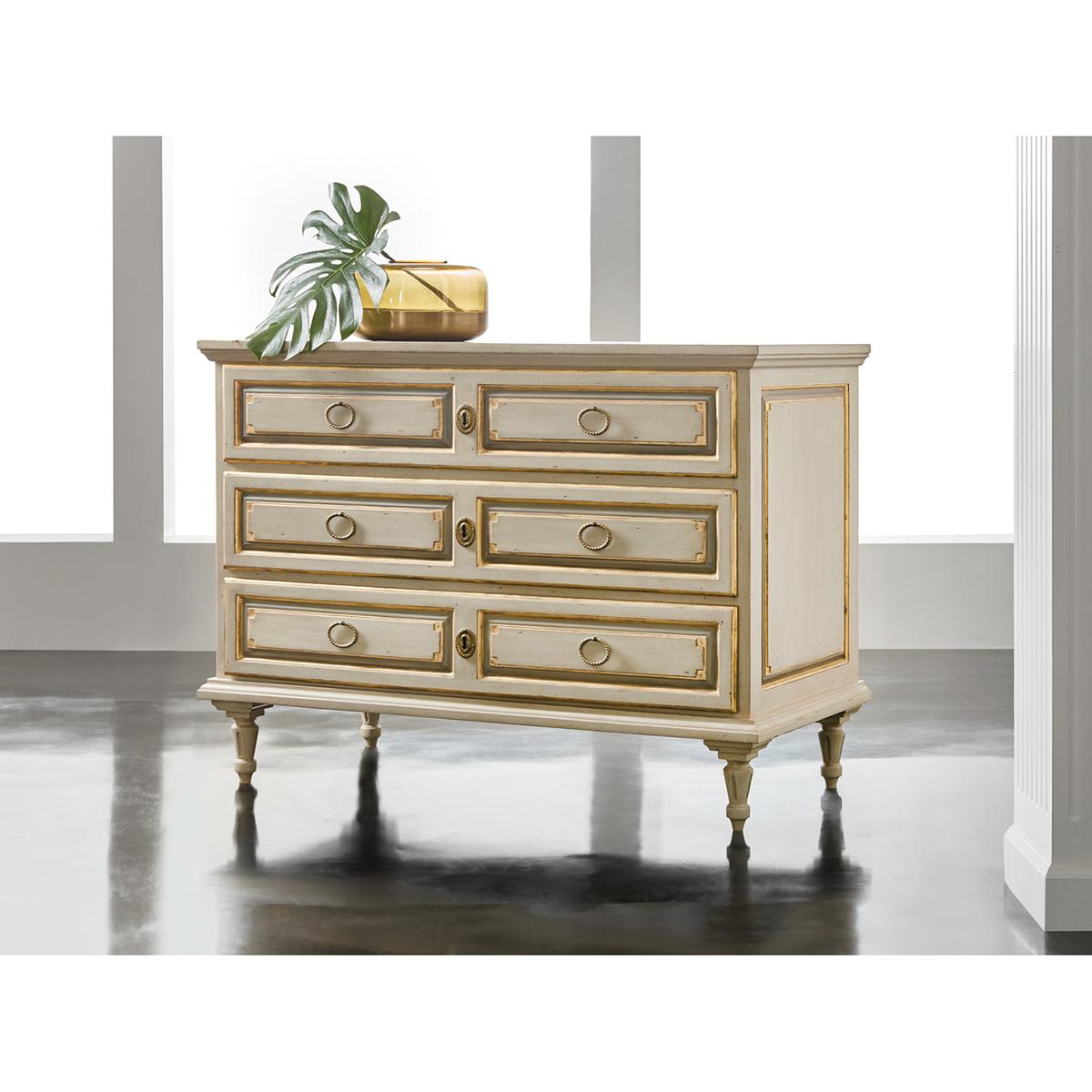 Large French Provincial Painted Commode. This French Directoire style provincial commode has an antiqued hand-painted finish with a rectangular molded top above three long paneled drawers with gilded trim, with paneled sides also with gilded trim,