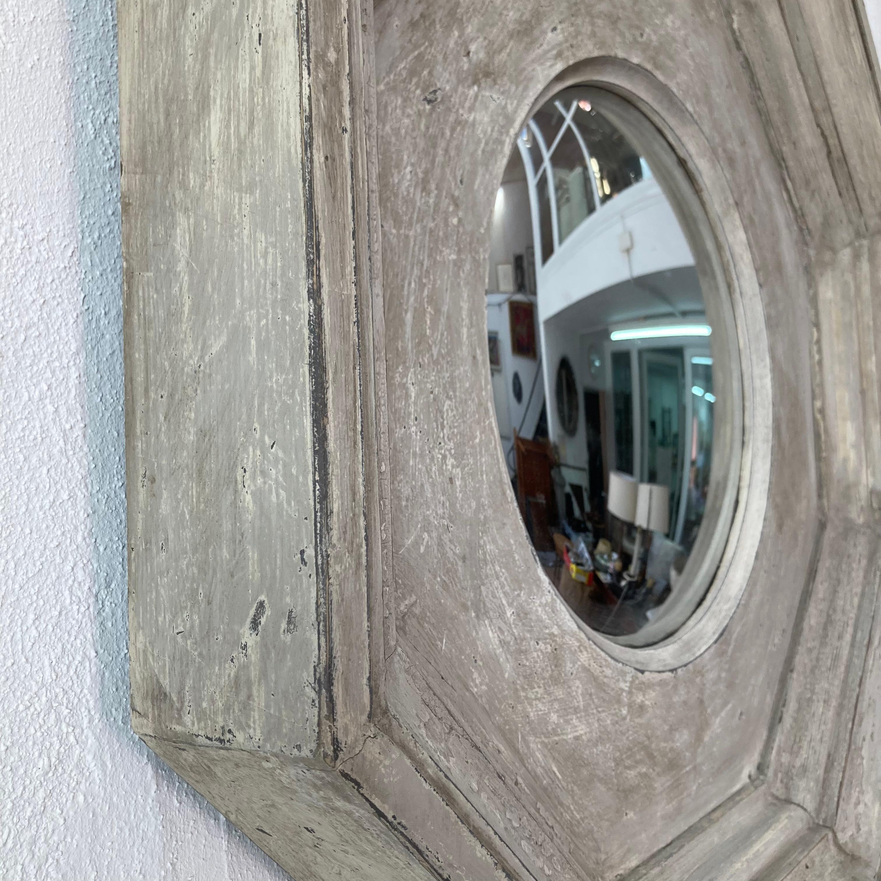 Statement octagonal mirror that sits in a deep and strong wood octagonal frame, this is painted in a soft grey paint. Perfect for a French Provincial farmhouse, or a more modern interior. This mirror is an excellent addition to any interior.
