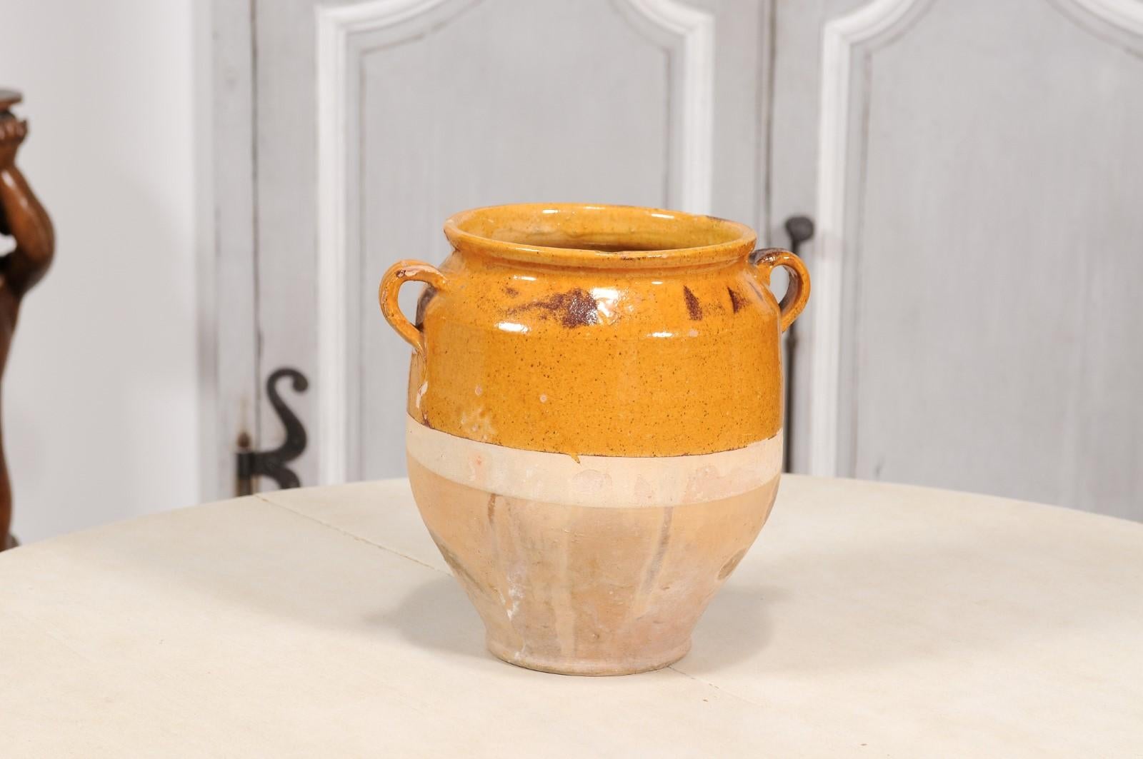 Glazed French Provincial Pot à Confit Pottery with Warm Yellow Glaze and Two Handles For Sale