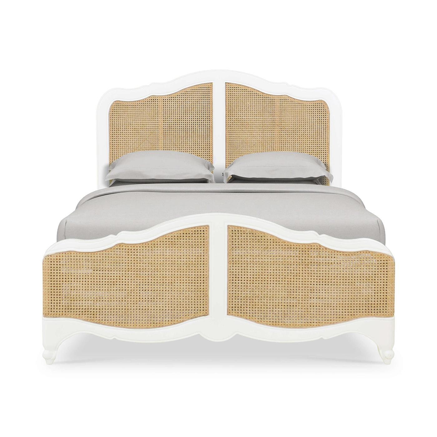 An 18th-century inspired, Louis XV-style carved bedframe, in a light hand-rubbed and distressed Architectural White finish.

The serpentine crest headboard features inset caned rattan in a natural finish. The serpentine footboard with inset rattan