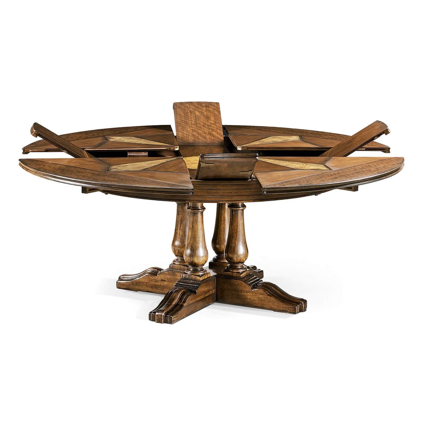 Rustic French provincial round extension dining table in a rustic country finish with ingenious revolving self-storing leaf mechanism, with walnut parquetry top and a clustered turned pedestal base.

Open dimensions: 73.75
