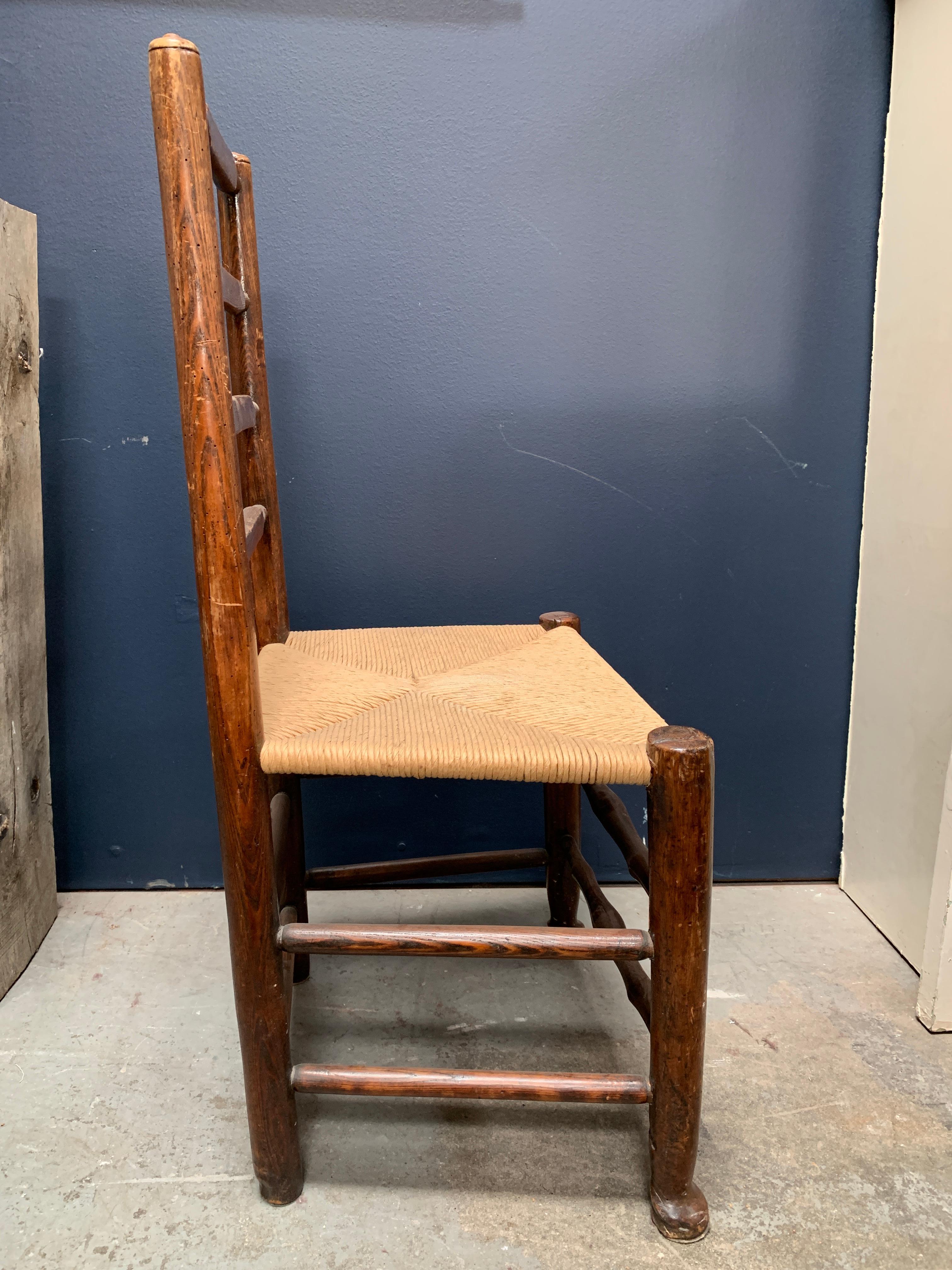 Beautiful vintage standalone chair, can be used as an accent piece for various different styles. The rush seat and ladder back make a perfect pair for a Classic and timeless chair design that is comfortable, functional and one of a kind.