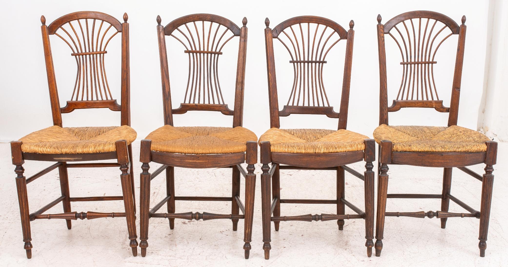French provincial rush-seated side chairs, 19th century or later, with arched crest rails, finials, and bent-spindle 