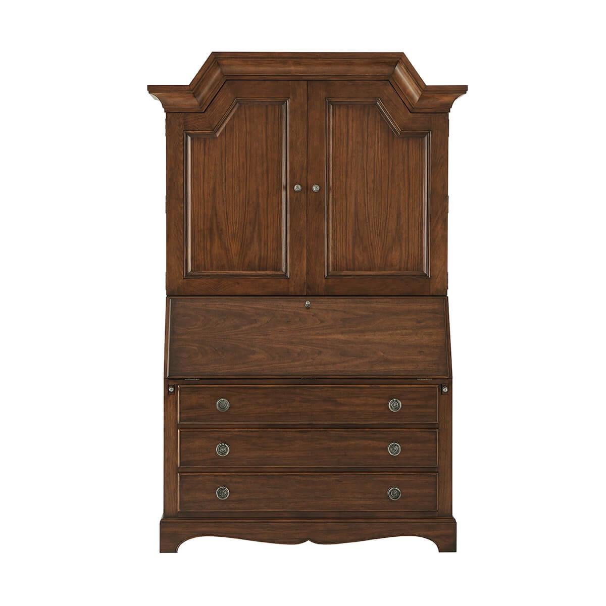 A French provincial secretary desk with an angled arched cornice above two paneled doors enclosing adjustable shelves, the midsection with a fall front writing surface with an interior fitted drawers, supported by a lower section of three long