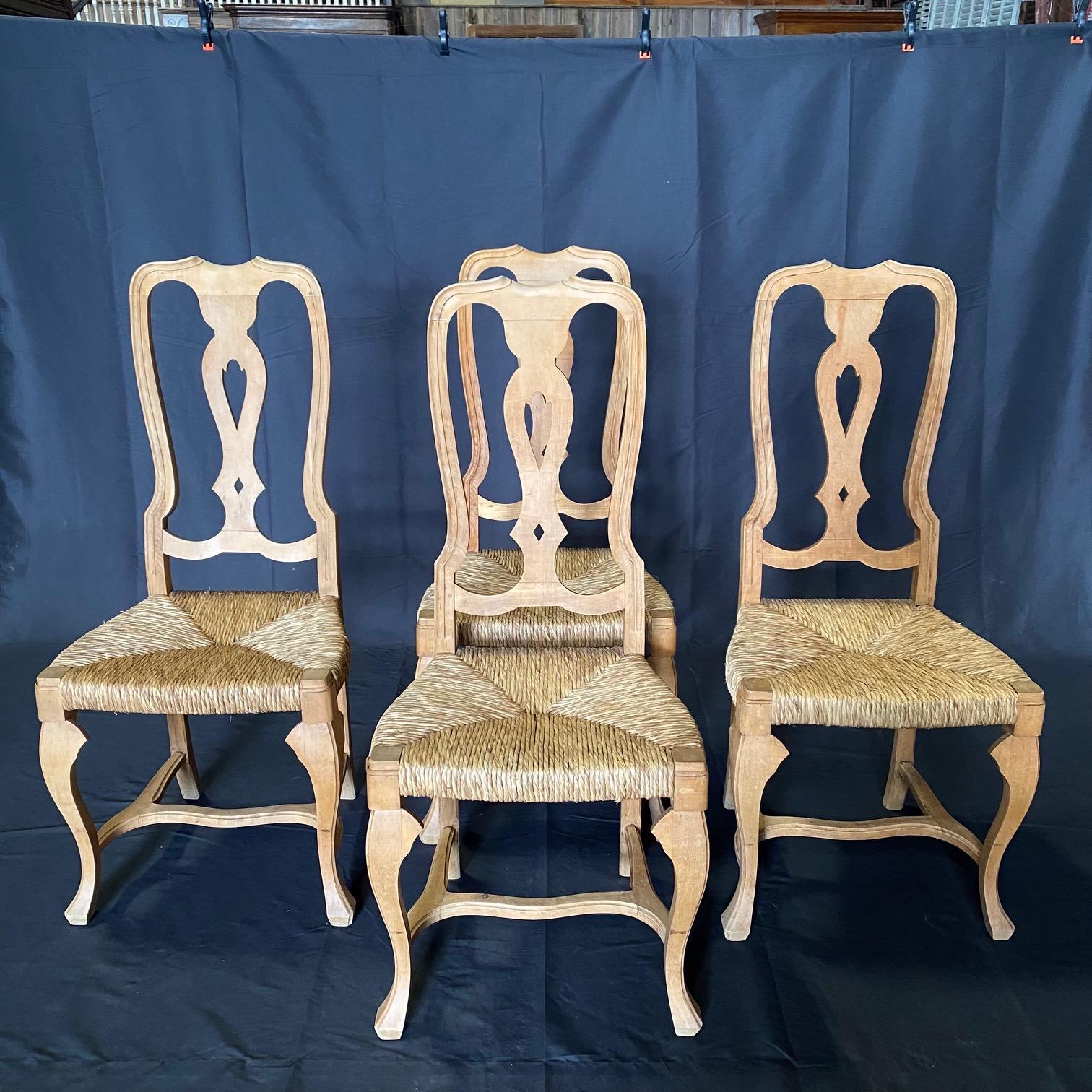 Gorgeously finished set of 4 dining side chairs in bleached walnut and lovely authentic rush seats. Curved cabriole style legs and elegant pierced splats on the backs.  #6196