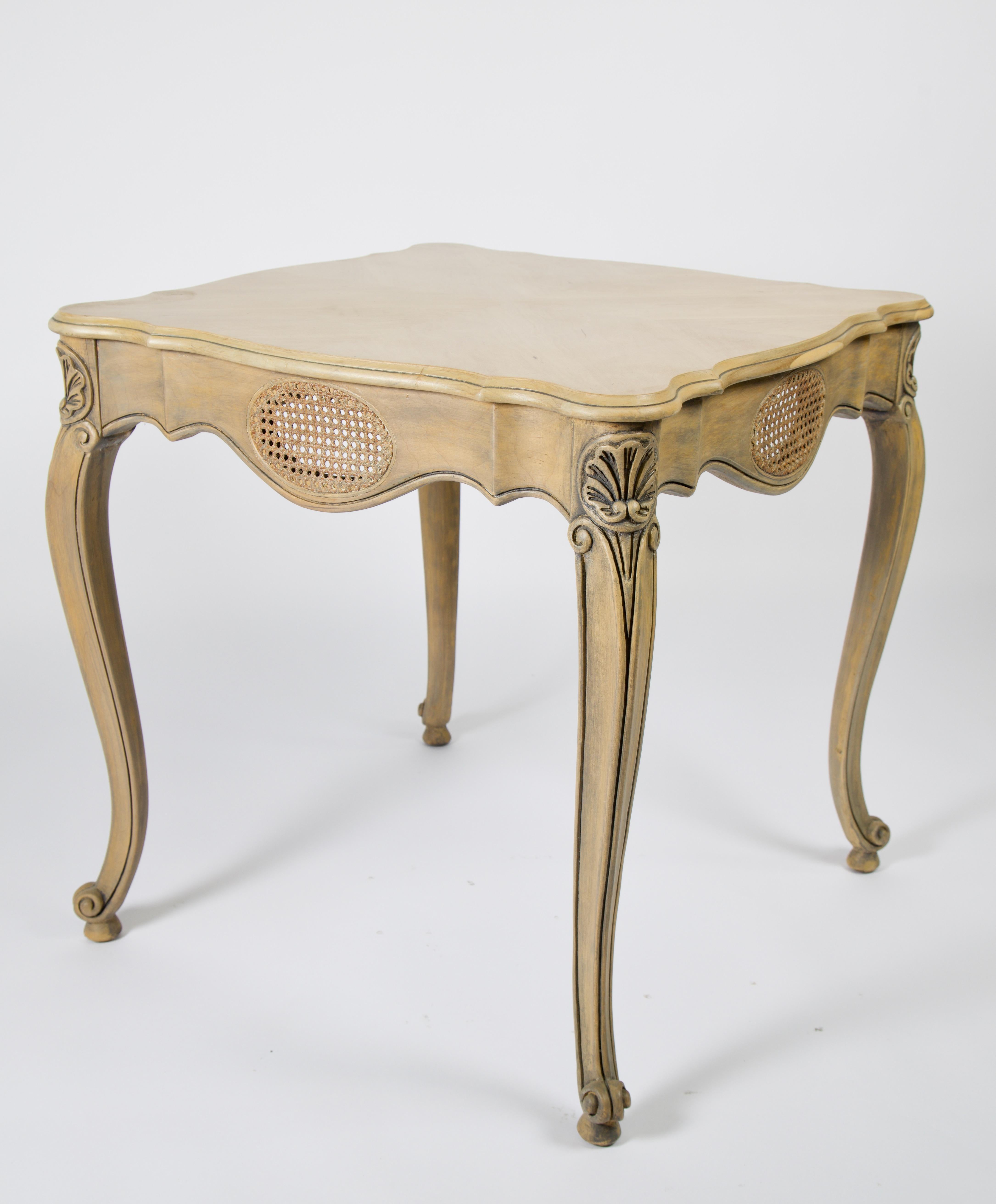 A set of French Provincial side tables. These have been stripped of the original finish and bleached with details enhanced in black. Beautiful book match veneer top and solid hardwood construction with elegant cabriole legs. The bleached wood