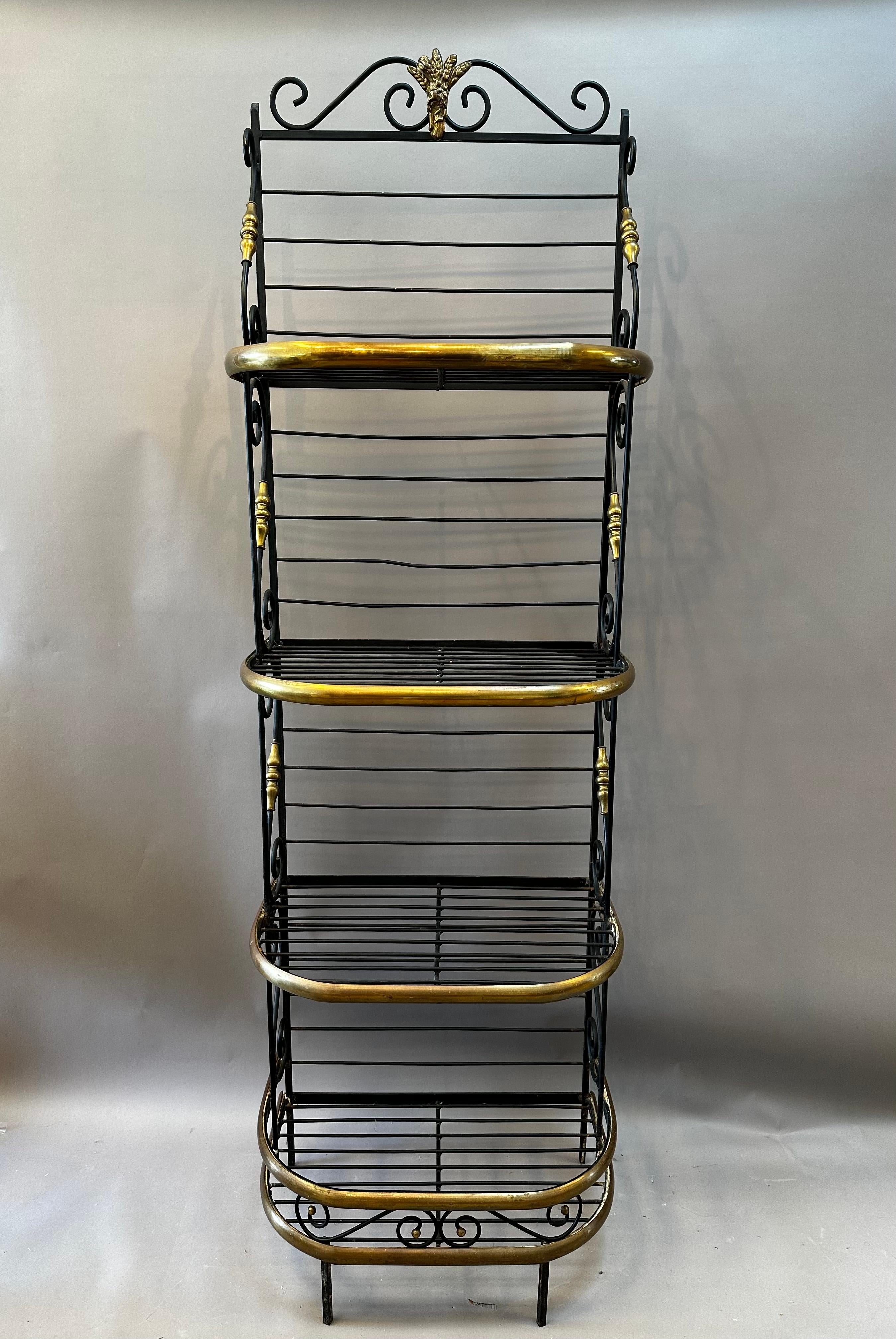 19th Century French Provincial Baker’s Rack. Wonderful Craftsmanship Made of scrolled steel with decorative brass details. Rare Small proportions. Normandy, circa 1890.