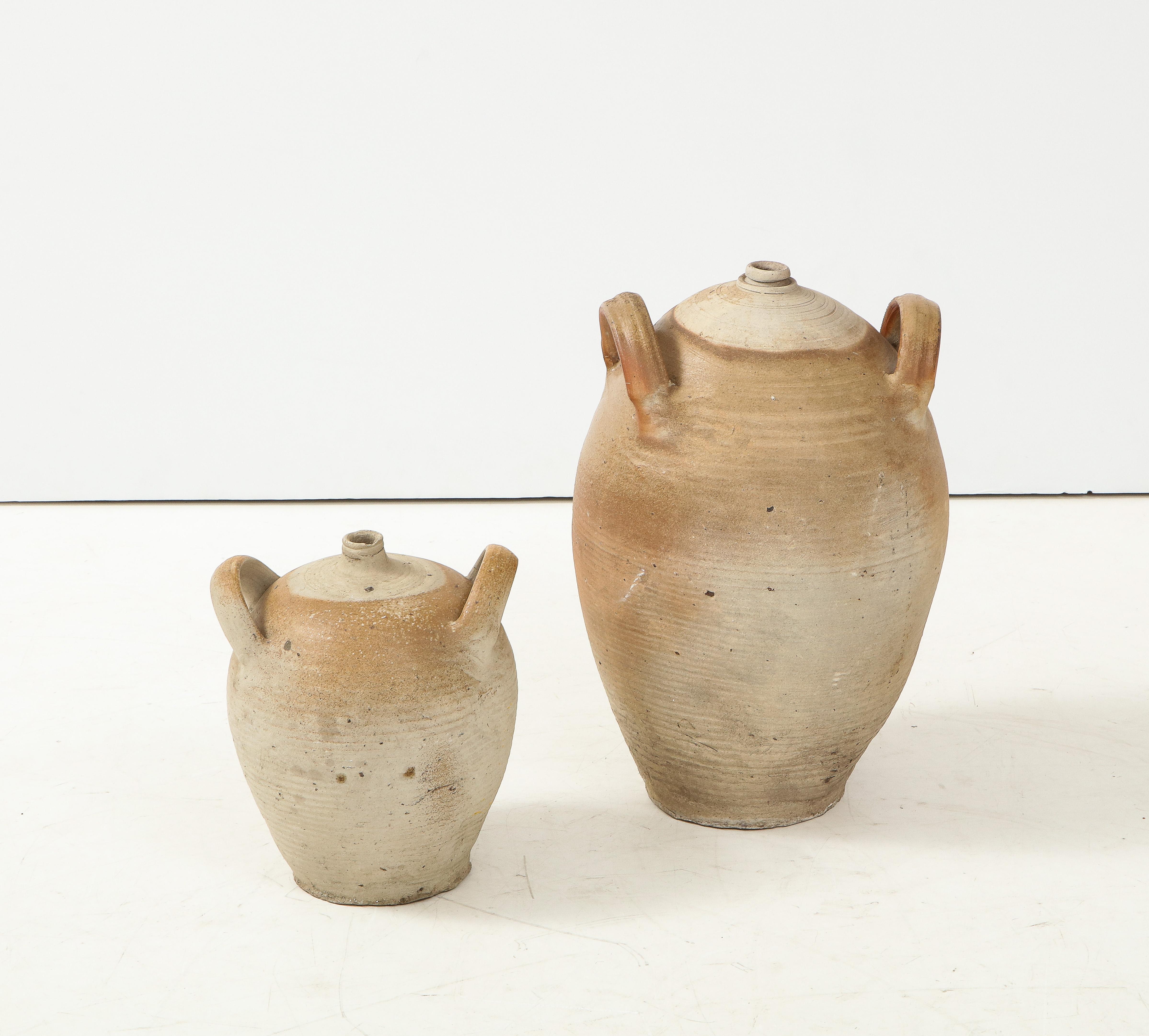 French Provincial Stoneware vintage pottery oil jar, jug, vase or vessel.
France, circa 1960 
Size: Tall: 19