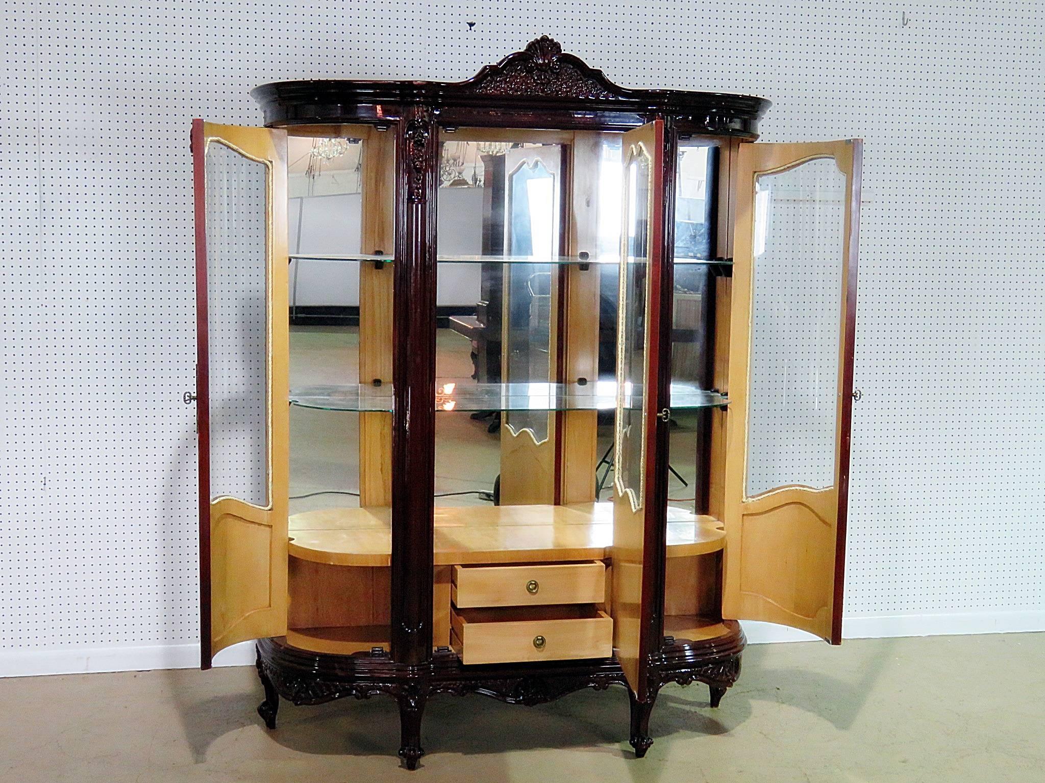 French Provincial style inlaid china cabinet with three glass shelved, three doors and two drawers.