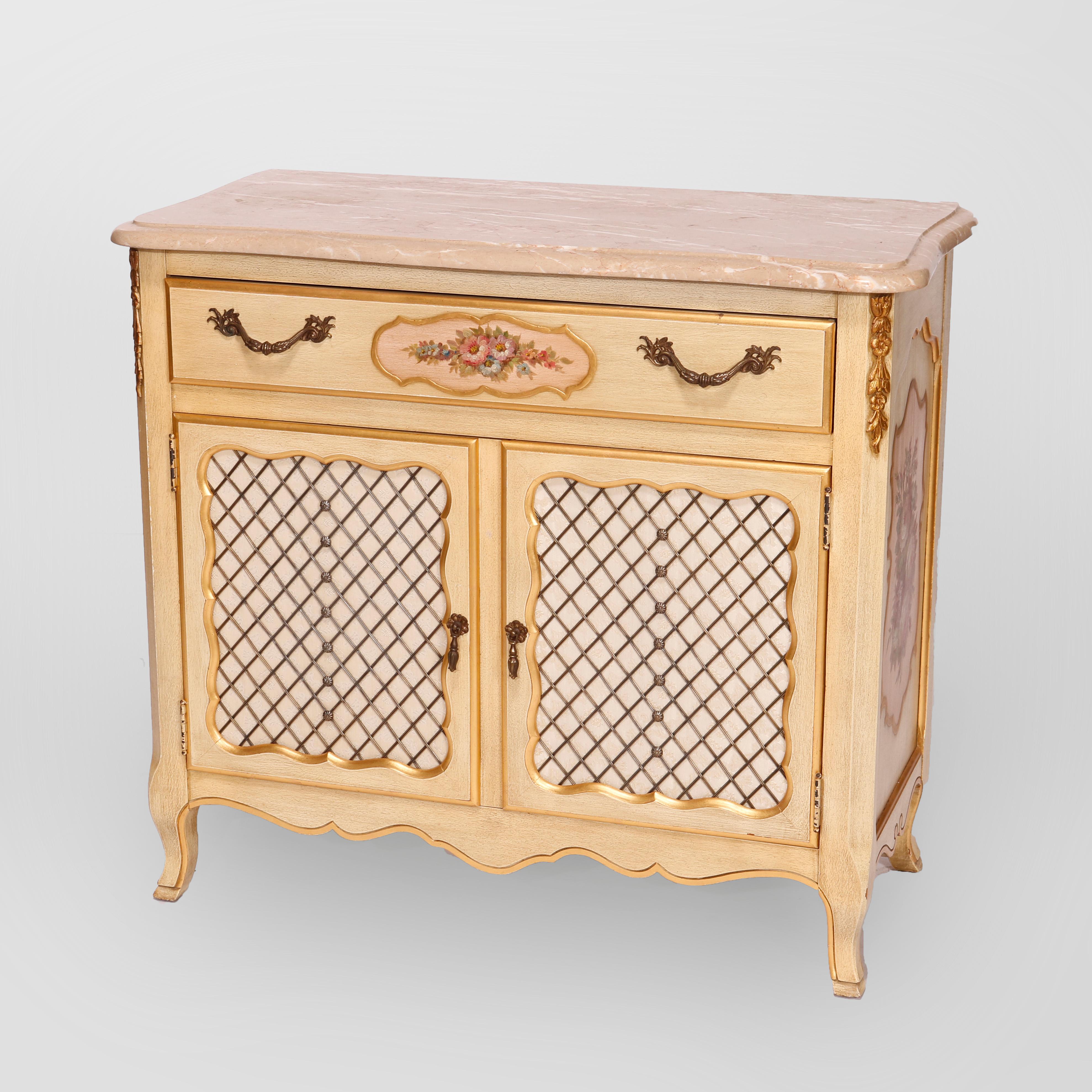 A vintage French Provincial style commode by Kosak Studios offers shaped and beveled marble top over paint decorated case with single drawer over double lattice door cabinet having floral reserves, gilt foliate elements and raised on cabriole legs,