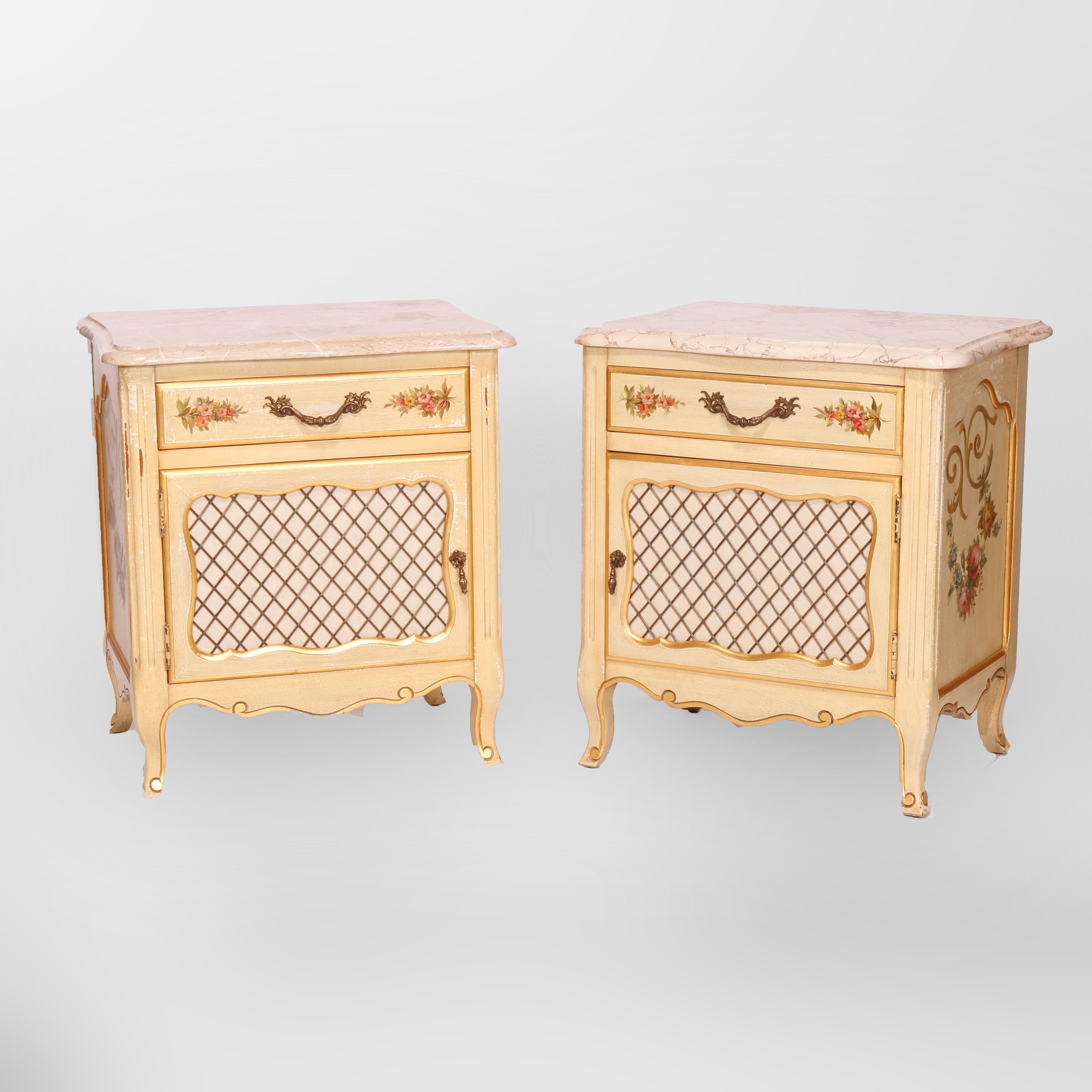 A vintage pair of French Provincial style side stands by Kosak Studios offers shaped and beveled marble tops over paint decorated cases with single drawer over lattice door cabinet having floral reserves, gilt foliate elements and raised on cabriole