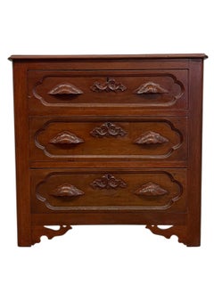 French Provincial Style Three-Drawer Chest with Carved Leaf Motifs.
