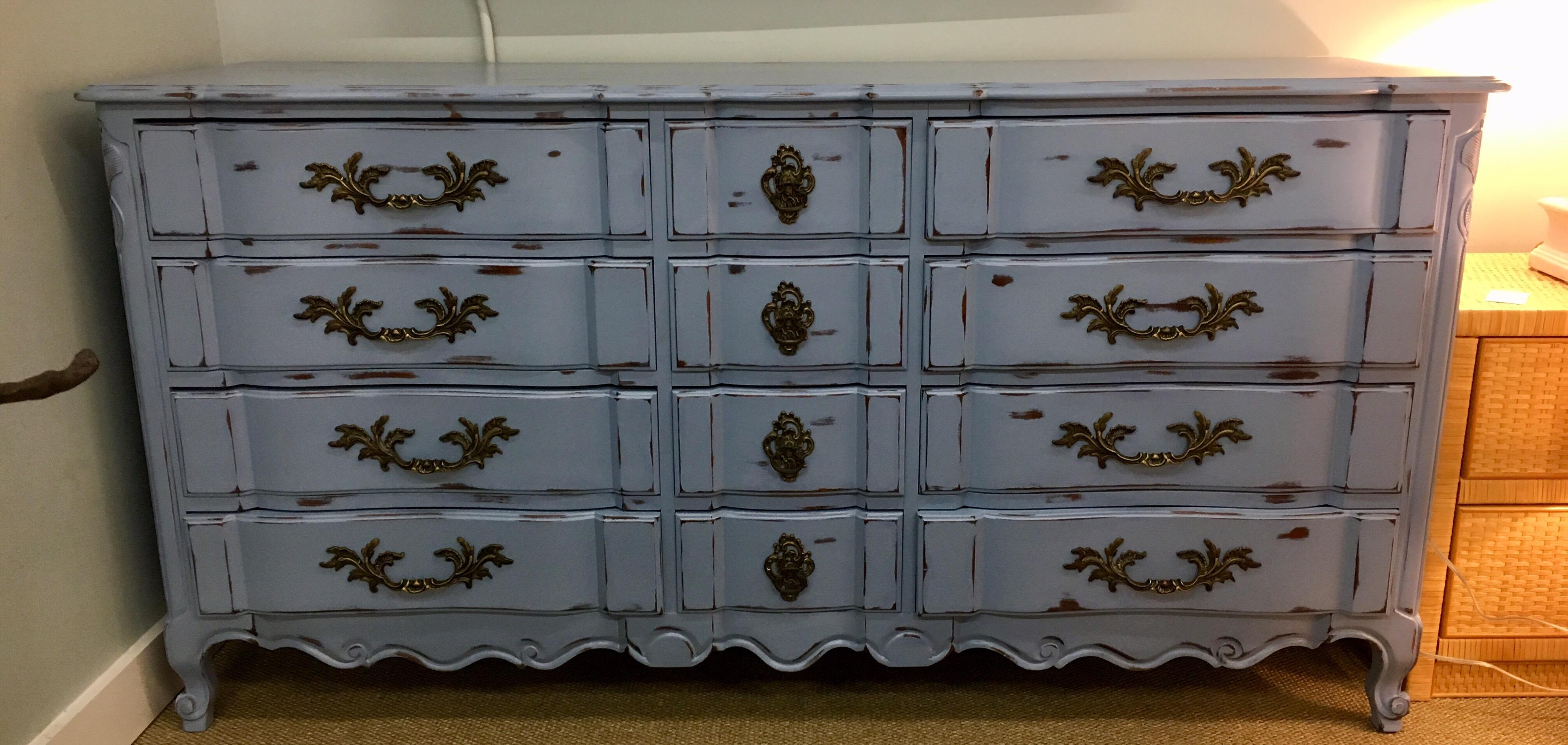 Magnificent twelve-drawer dresser that has been professionally refurbished and painted in a French
blue that has to be seen to be appreciated. All hardware is original and there are twelve drawers in all.