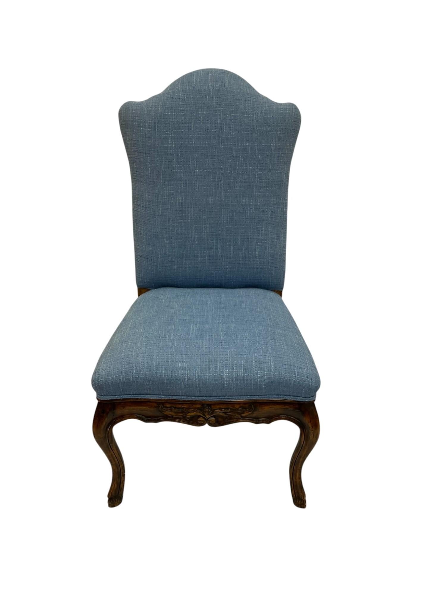 Elegant and timeless, this French Provincial-style side chair draws inspiration from the designs of Louis XV and Queen Anne.  Showcasing a sculpted top rail, carved apron, and classic cabriole legs. Upholstered in a textured linen-like fabric in a