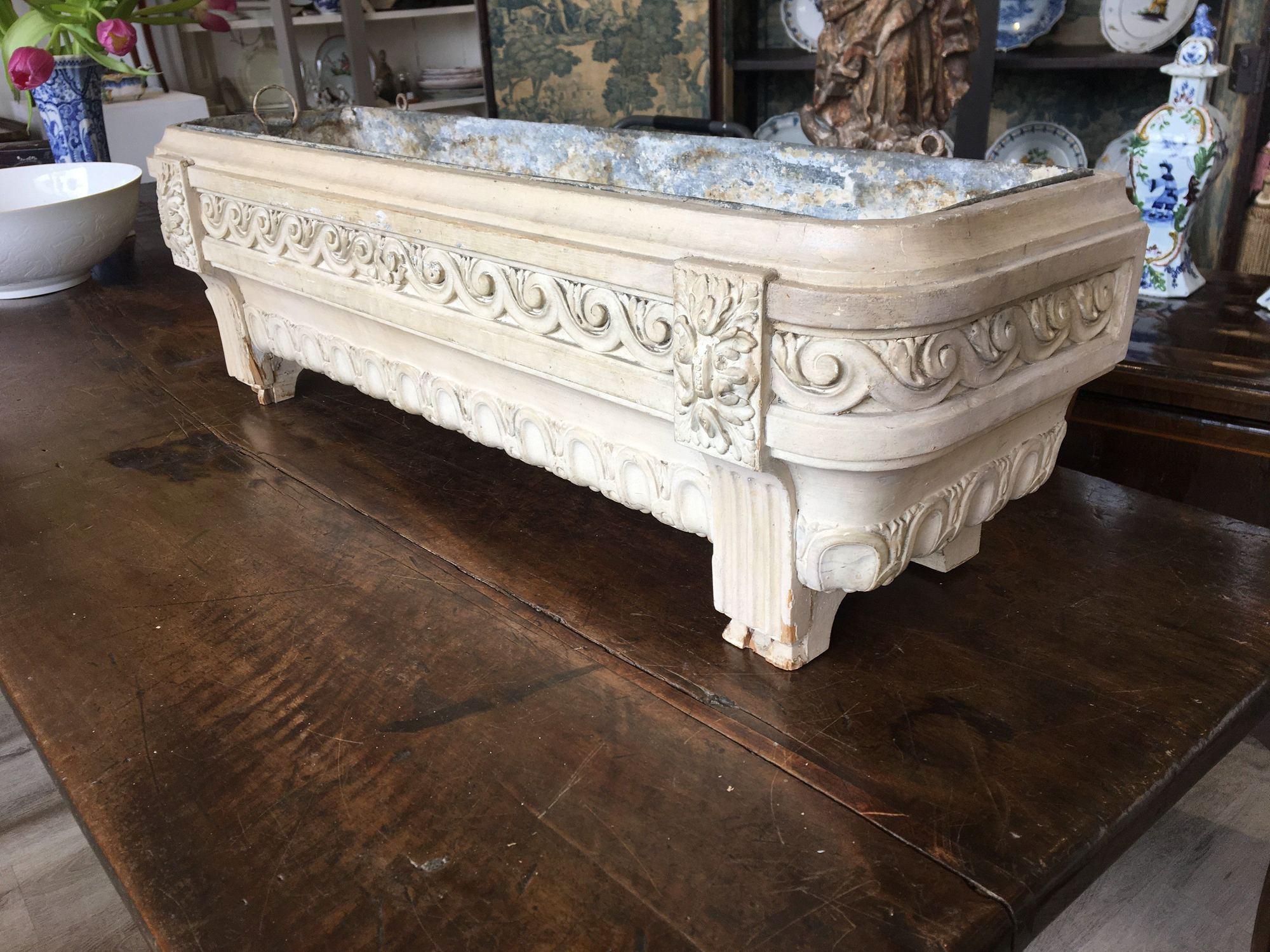 19th century French Provincial white painted, carved, jardinière with original zinc liner.