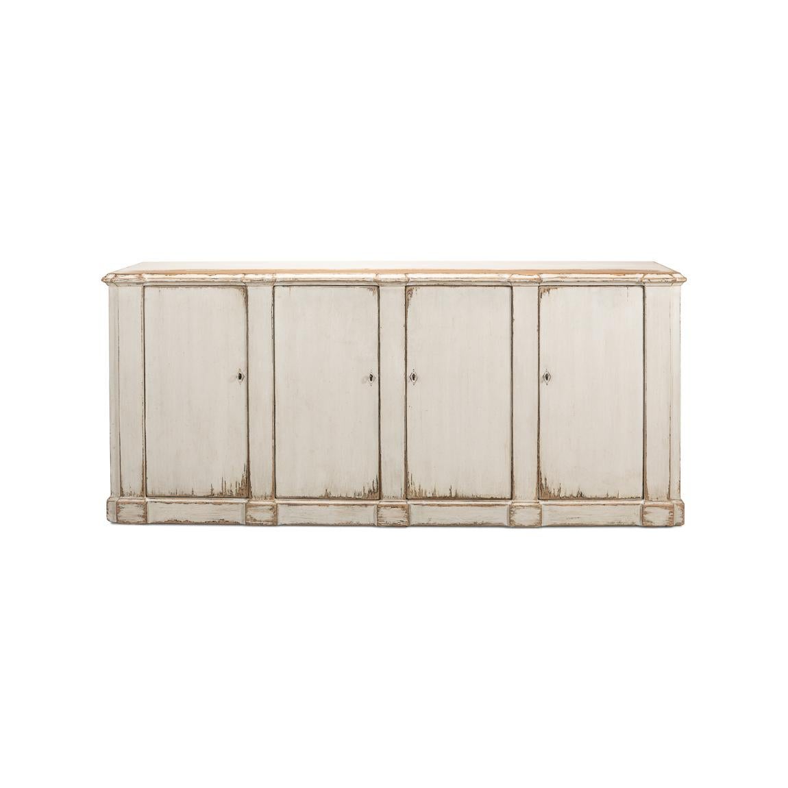 This piece captures the romantic essence of country style with its distressed white finish and vintage charm. The sideboard's generous length, accented by four doors that open to a fitted interior with removable shelves, offers substantial storage