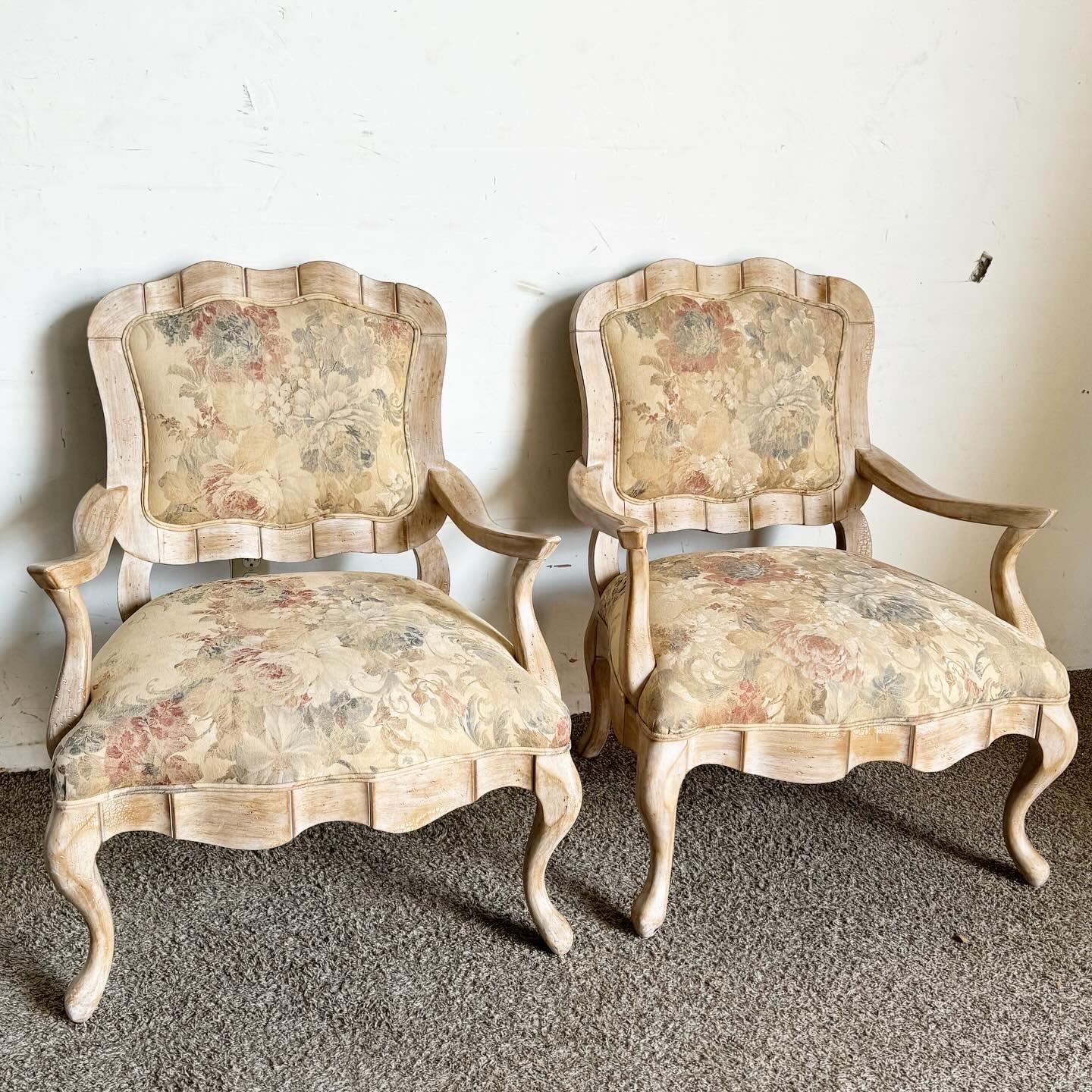 Indulge in the rustic elegance of the French countryside with these French Provincial White Washed Floral Print Lounge Chairs by Century Furniture. Featuring a white-washed finish and classic floral print upholstery, these chairs encapsulate the