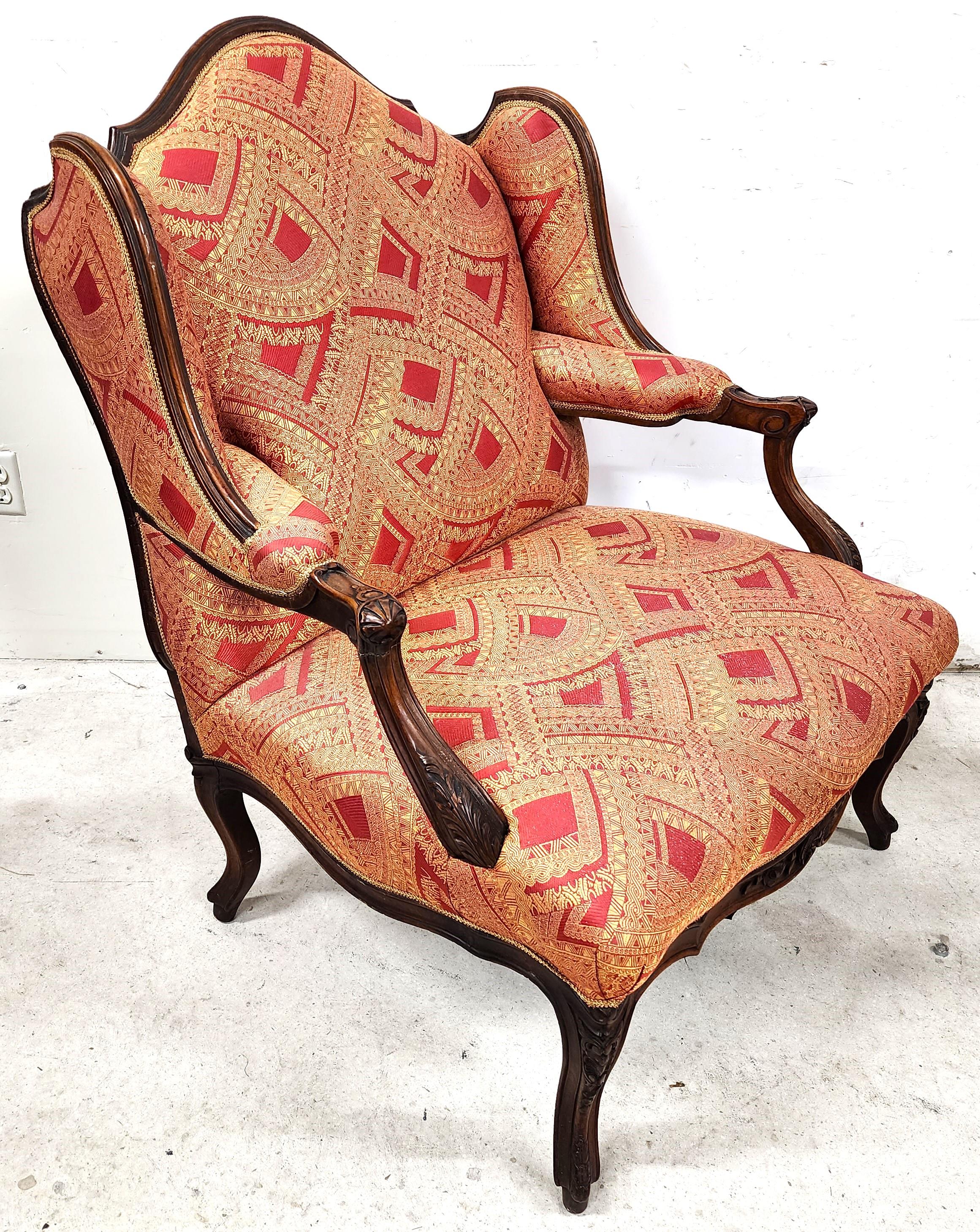 For FULL item description click on CONTINUE READING at the bottom of this page.

Offering One Of Our Recent Palm Beach Estate fine Furniture Acquisitions Of An
Antique French Provincial Carved Walnut Frame Wingback Armchair

Approximate