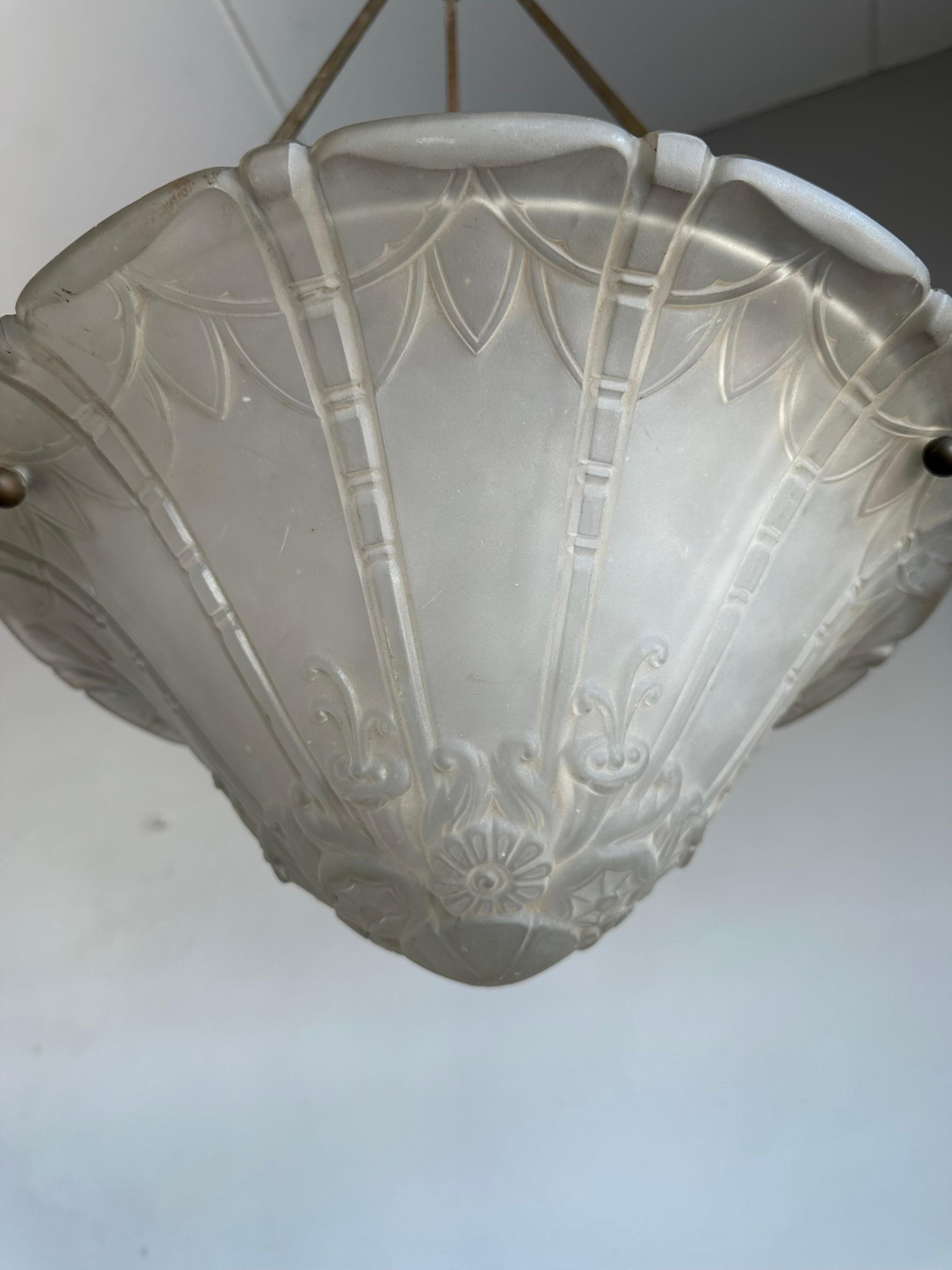Another top quality made, antique French Art Deco pendant light with the wow factor.

This Art Deco chandelier by Pierre D'Avesn was all hand-crafted at Daum's (Croismare, Nancy) studio in the early 1930s. This fine specimen is pressed in a thick