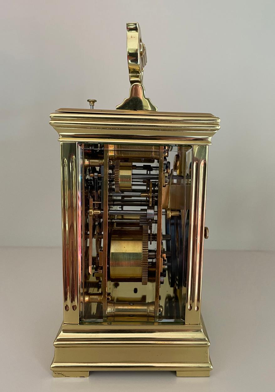 This is a beautiful French Gorge cased lacquered brass carriage clock circa 1880. The clock has beveled glass panels all round including the back door, white enamel rectangular dial with Roman numerals and original black hands; no chips or cracks to